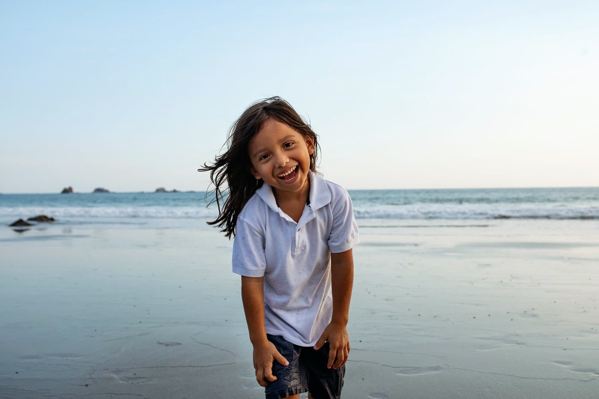 kid on beach in costa rica
