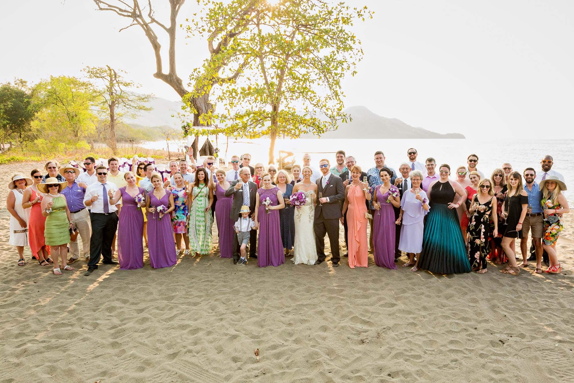 group photo on beach after wedding in costa rica