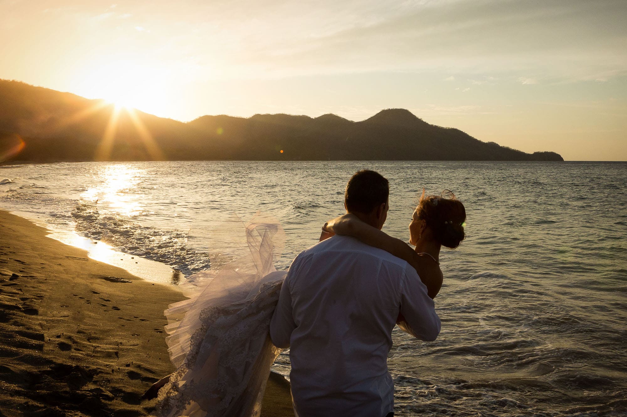 bride and groom at sunset on beach in guanacaste