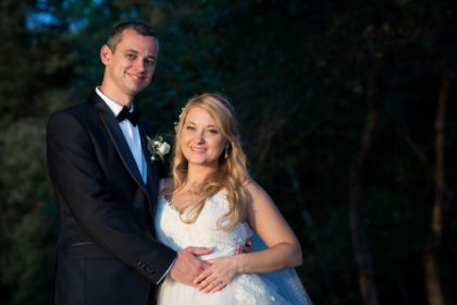 The happy bride and groom pose for a formal bridal portrait