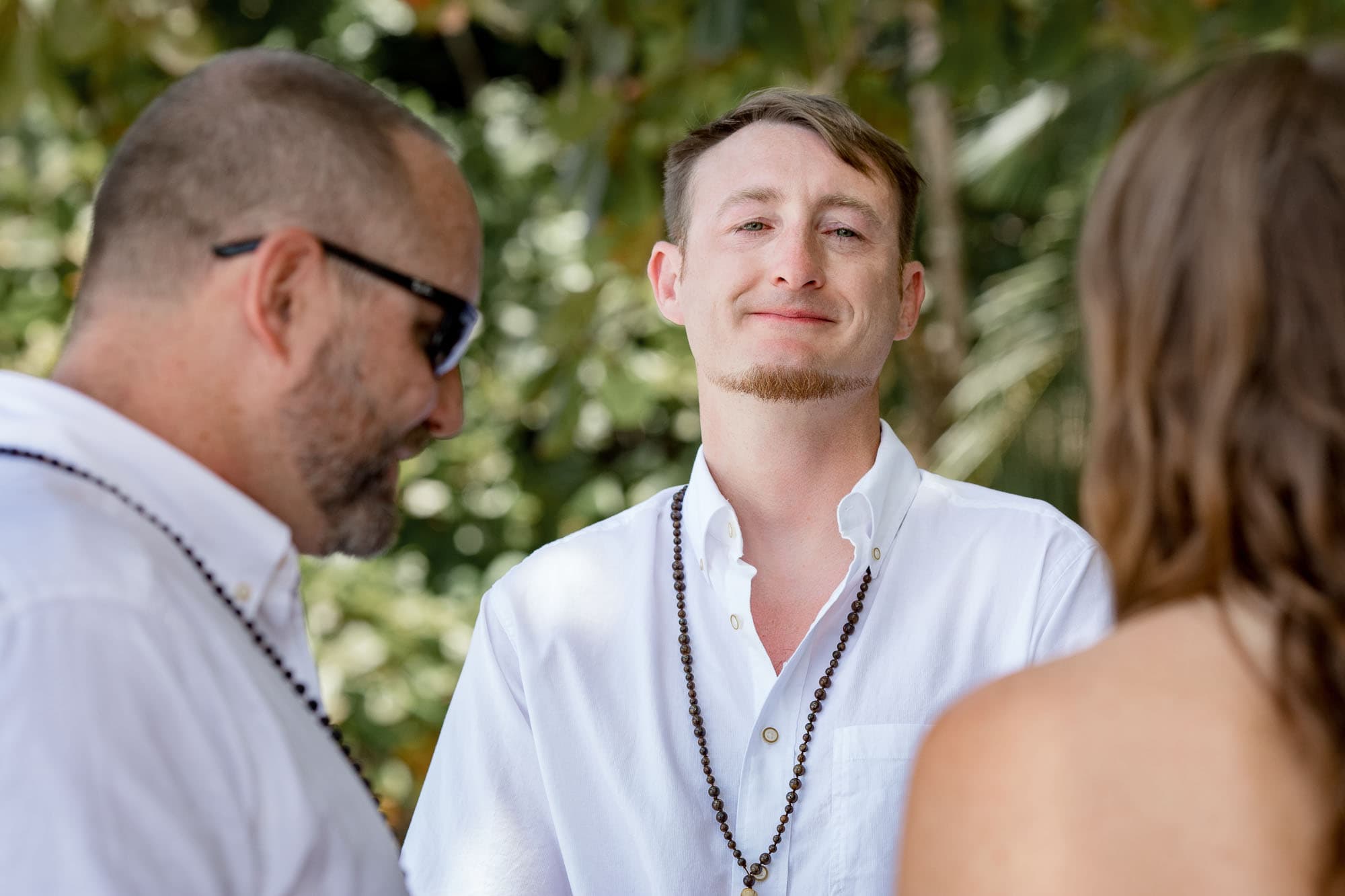 The groom tears up during the ceremony