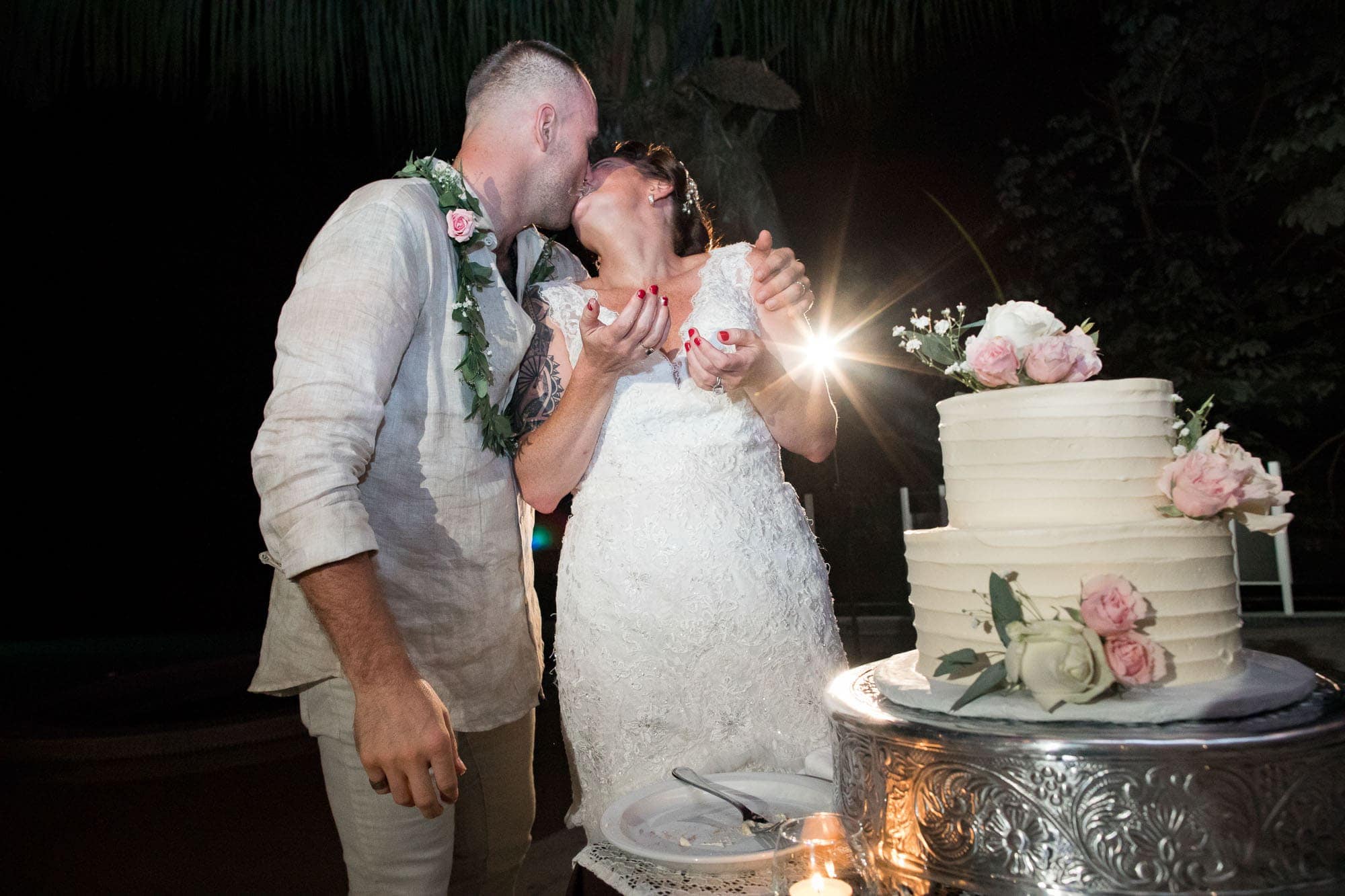 Cutting the cake and sharing a kiss
