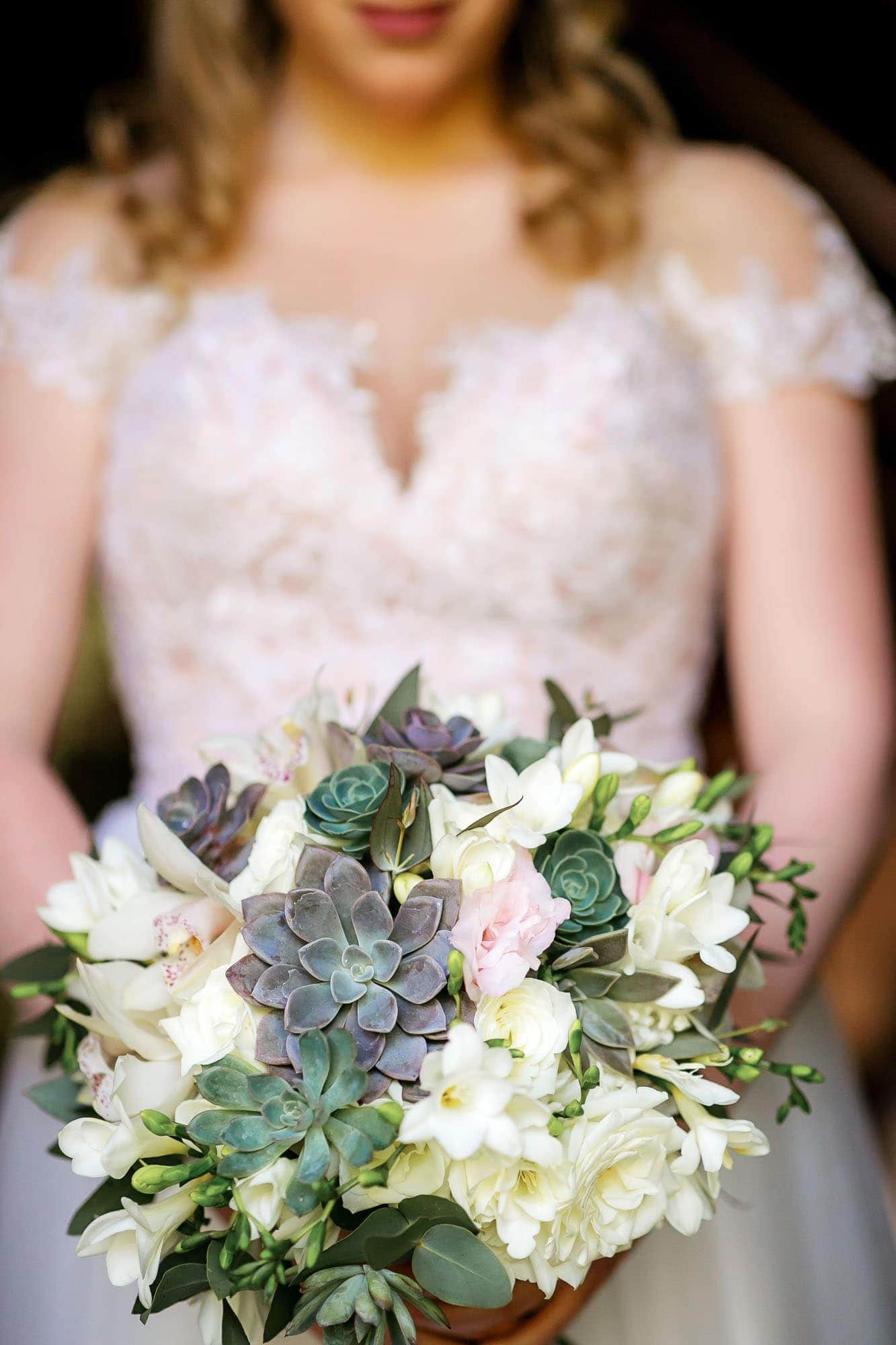 Closeup of the bride's unique bouquet in her hands
