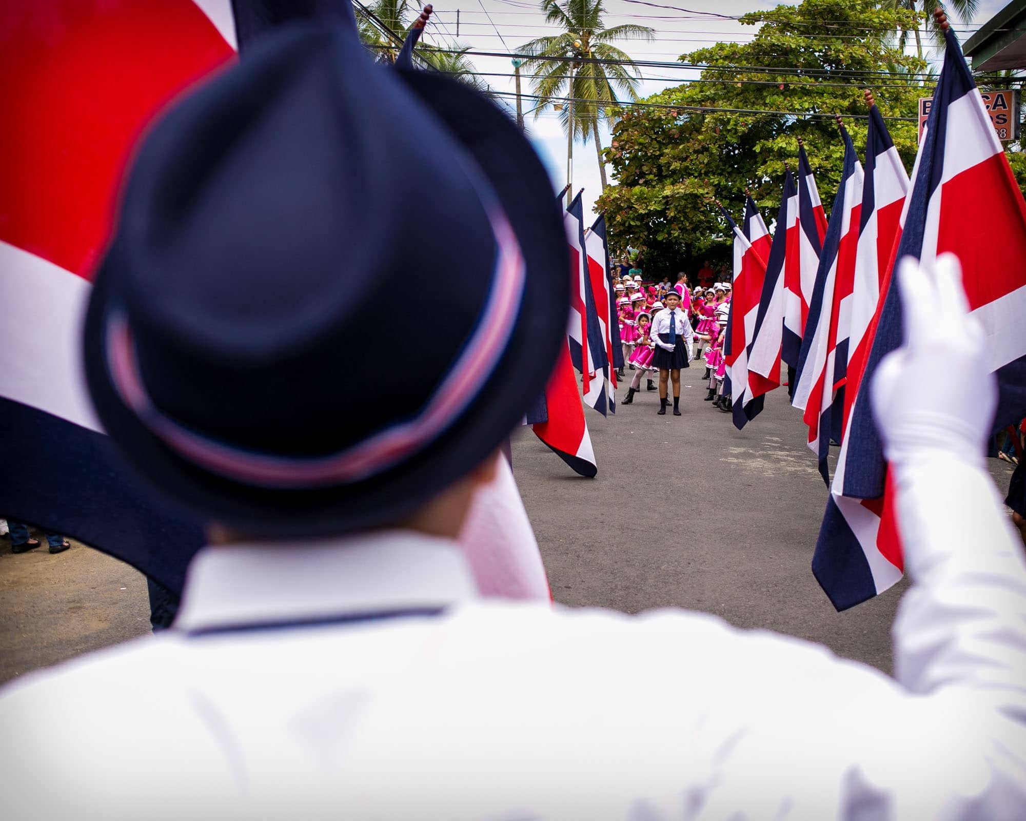Marching with flags in the parade for Independence Day in Costa Rica
