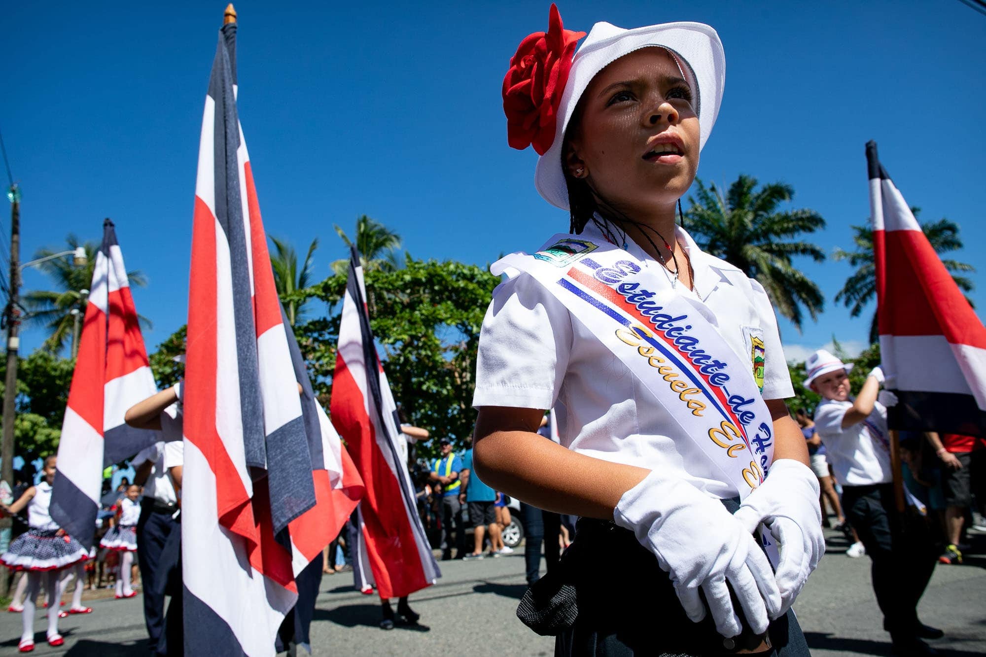 Marching with flags in the parade for Independence Day in Costa Rica