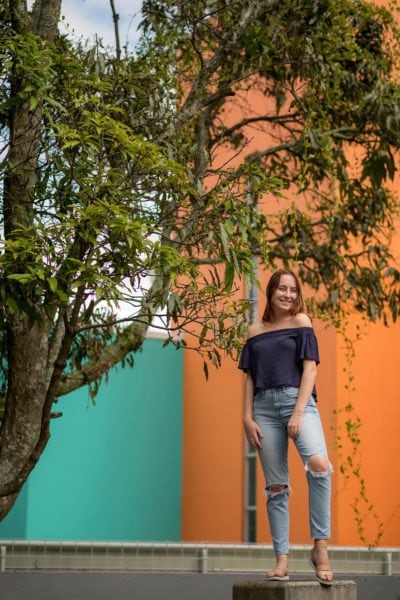 girl in front of orange wall