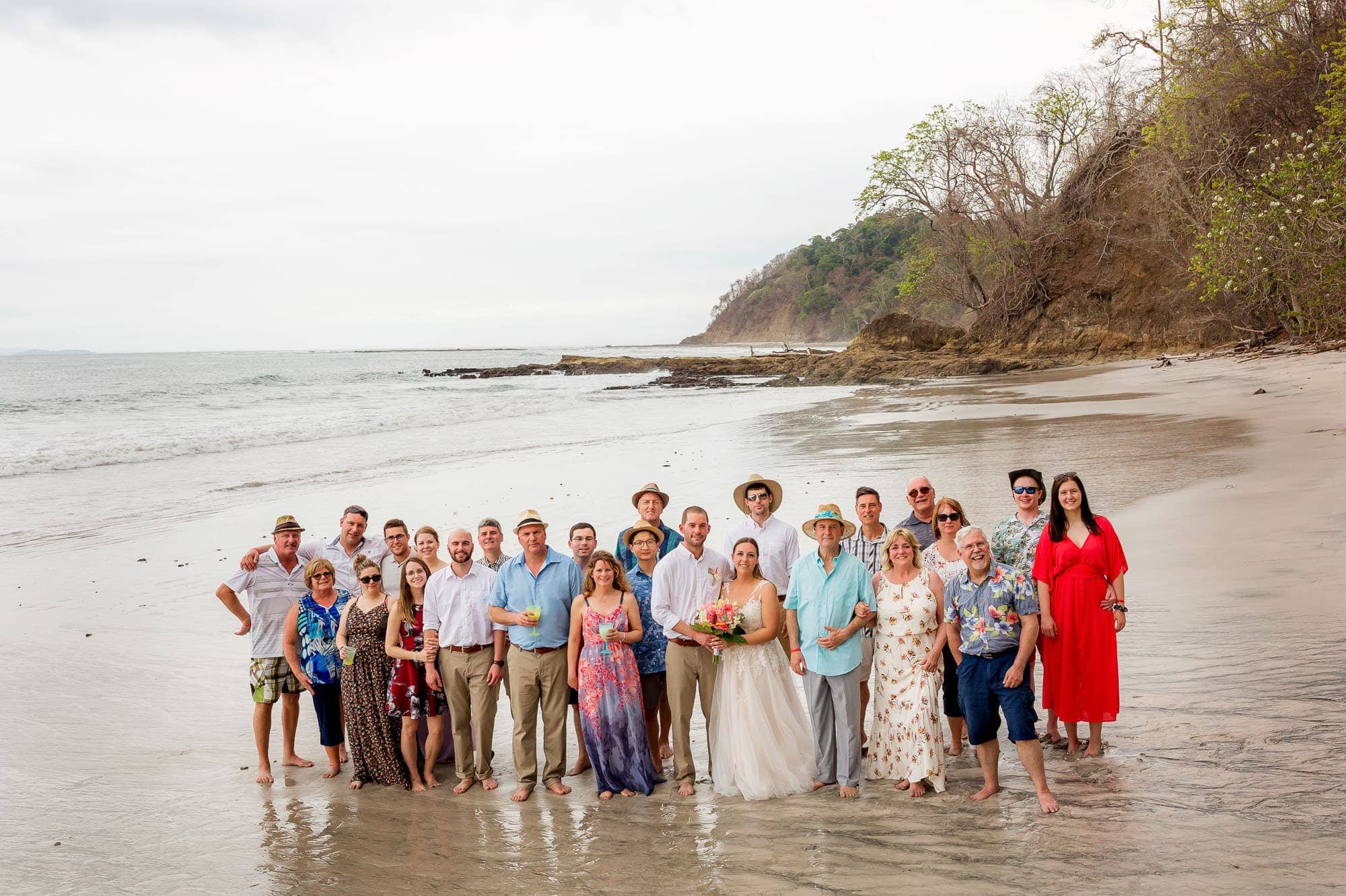 all the wedding guests on the beach