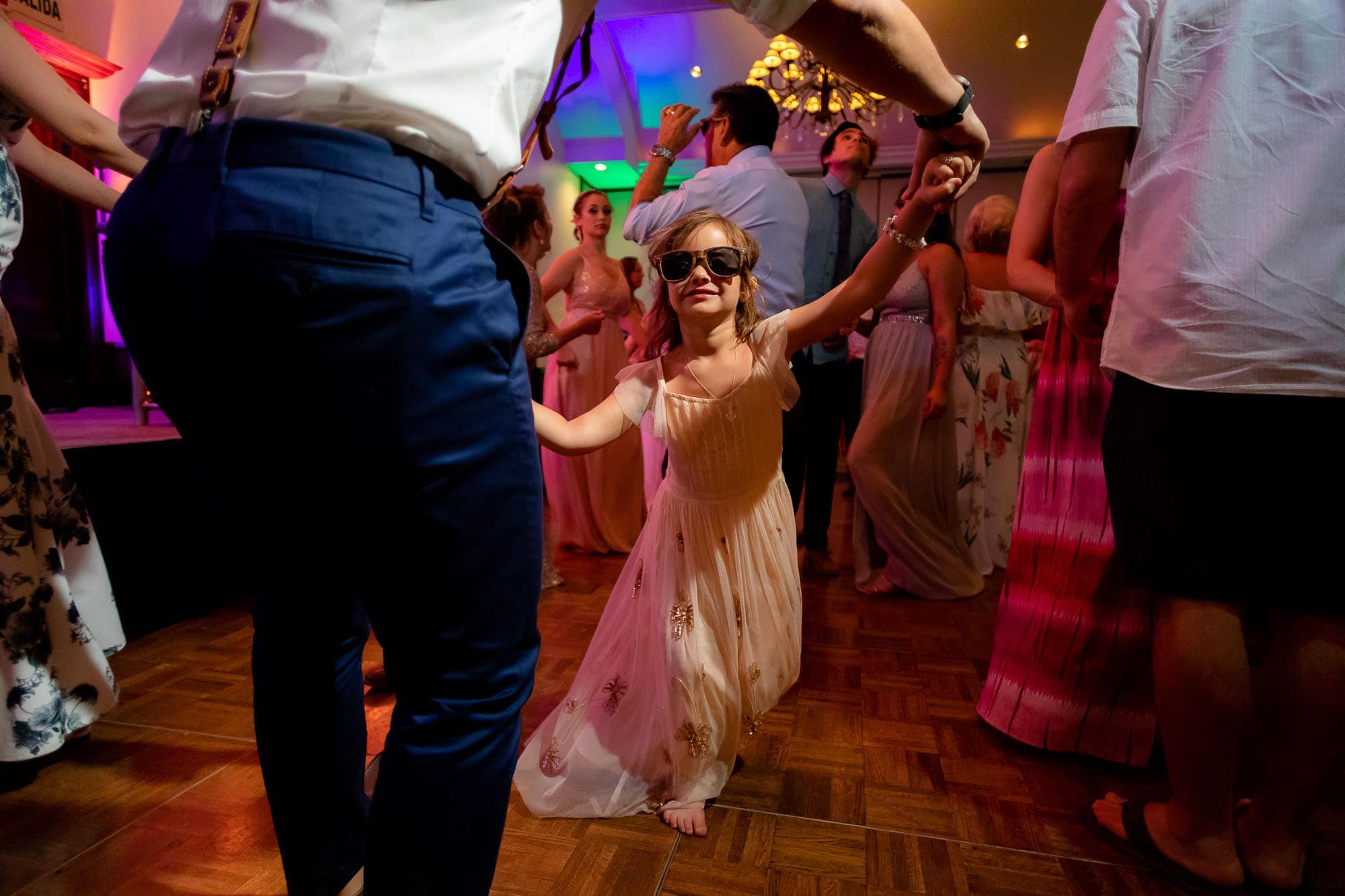 little girl dancing at wedding
