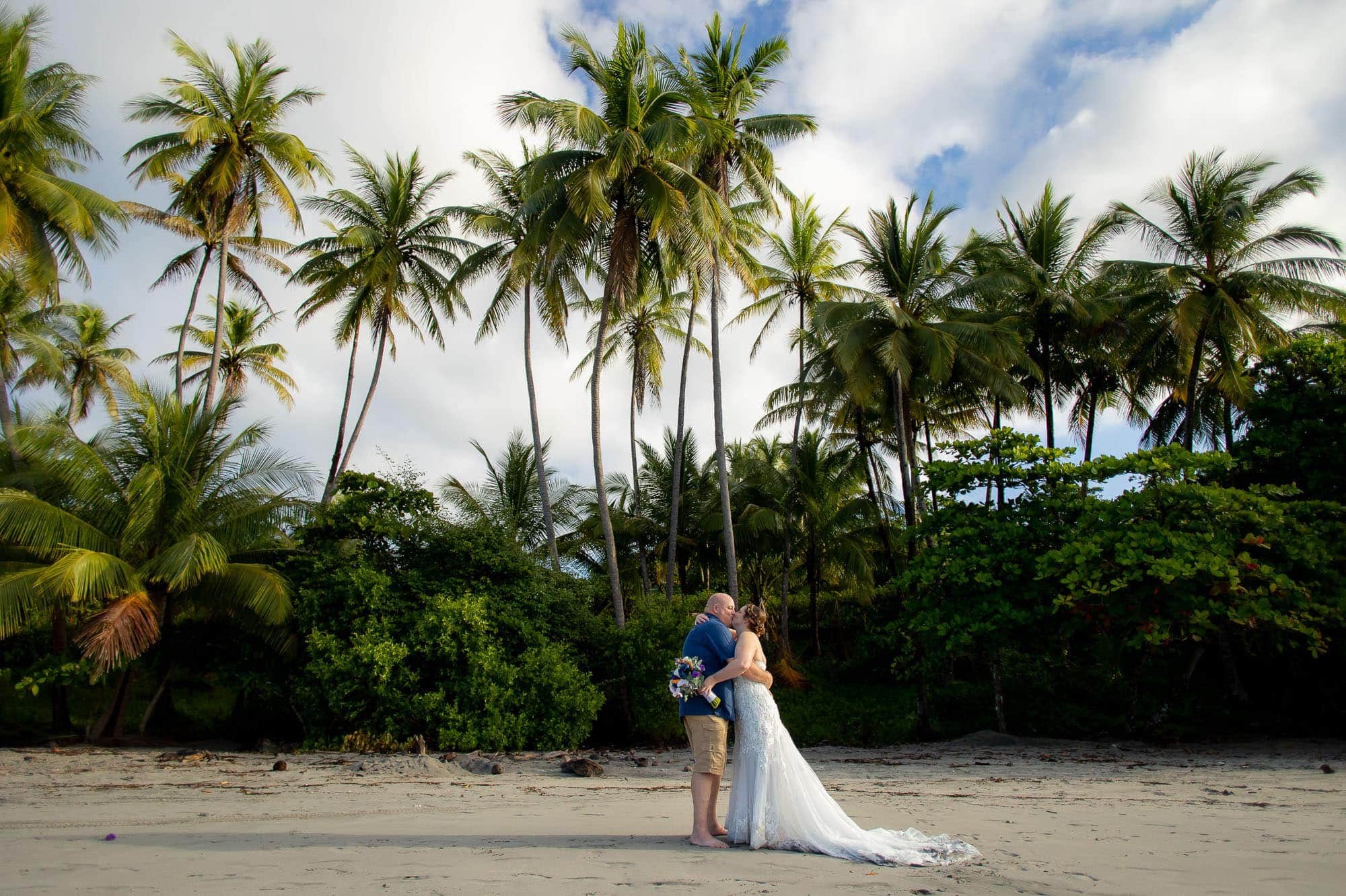 The bride and groom on the beach after their elopement at Hotel Parador in Costa Rica