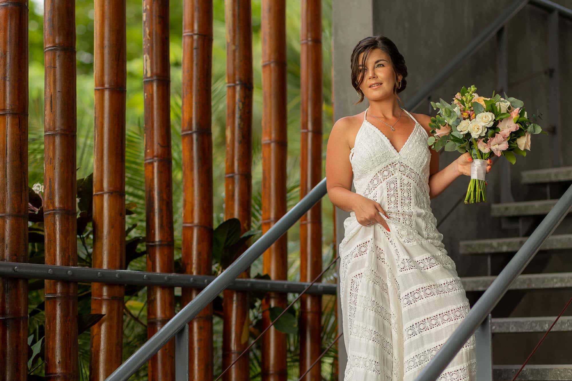 The bride descends the stairs on her way to her surprise wedding