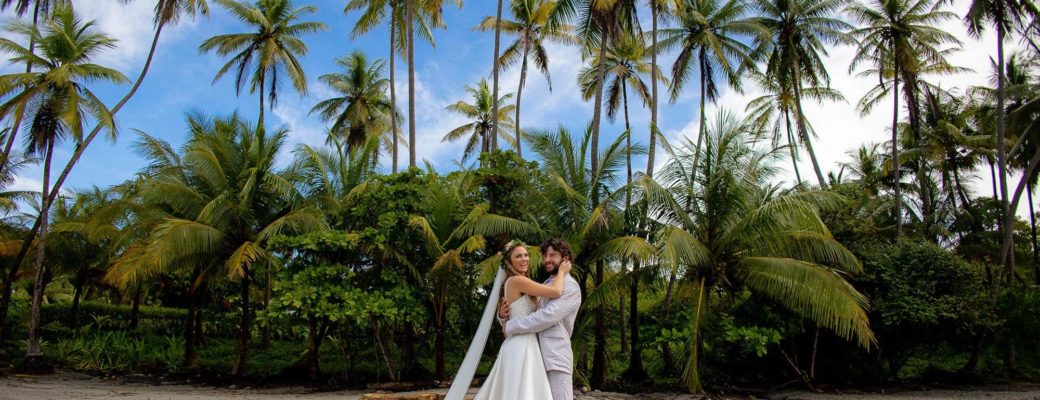 The bride and groom on the beach during their costa rica wedding getaway