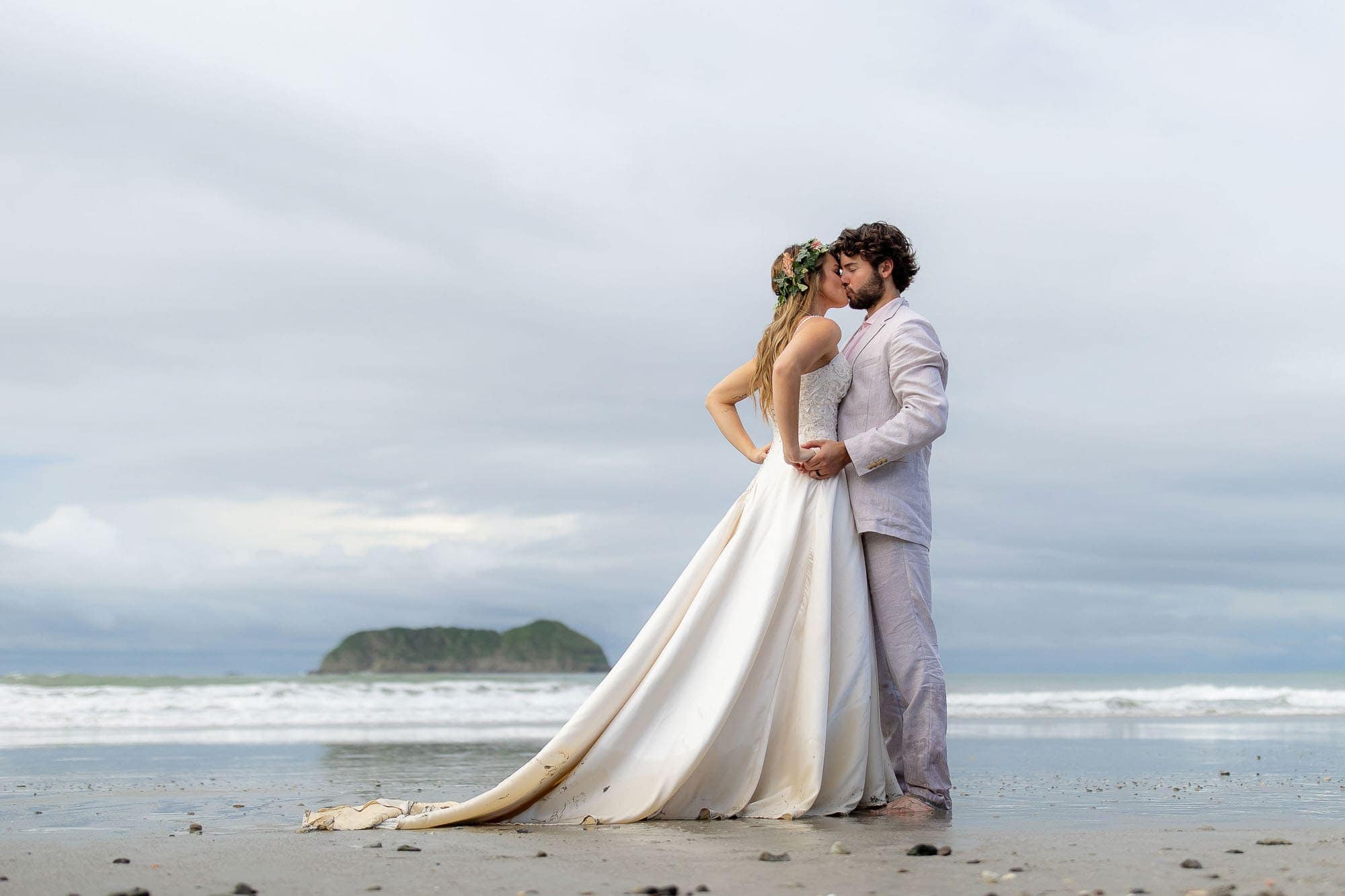 Photos of the bride and groom on the beach for a costa rica wedding getaway