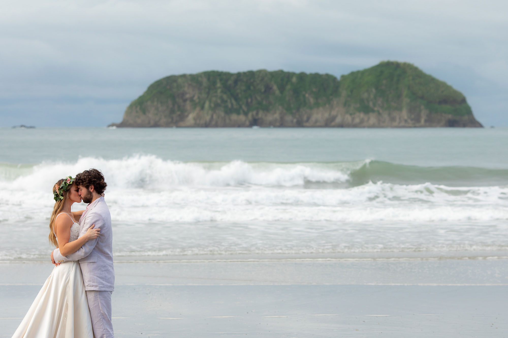 Photos of the bride and groom on the beach for a costa rica wedding getaway