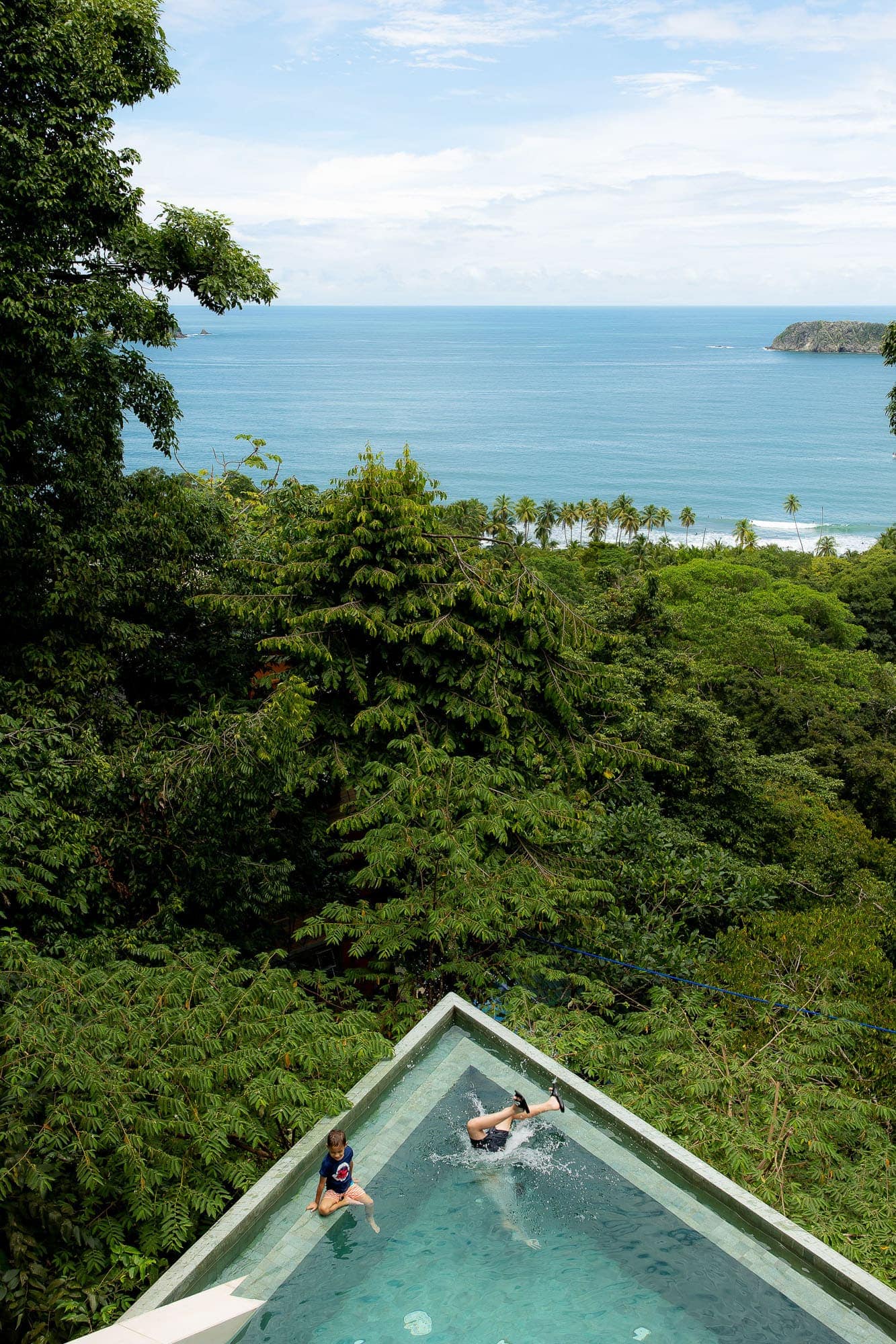 Enjoy the ocean view from a pointy pool overlooking the jungle