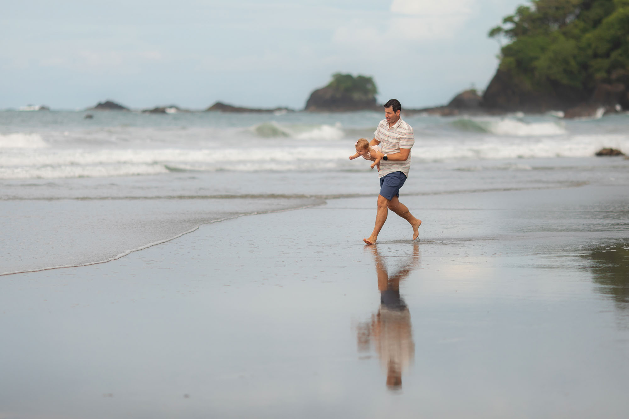 running on beach as a family