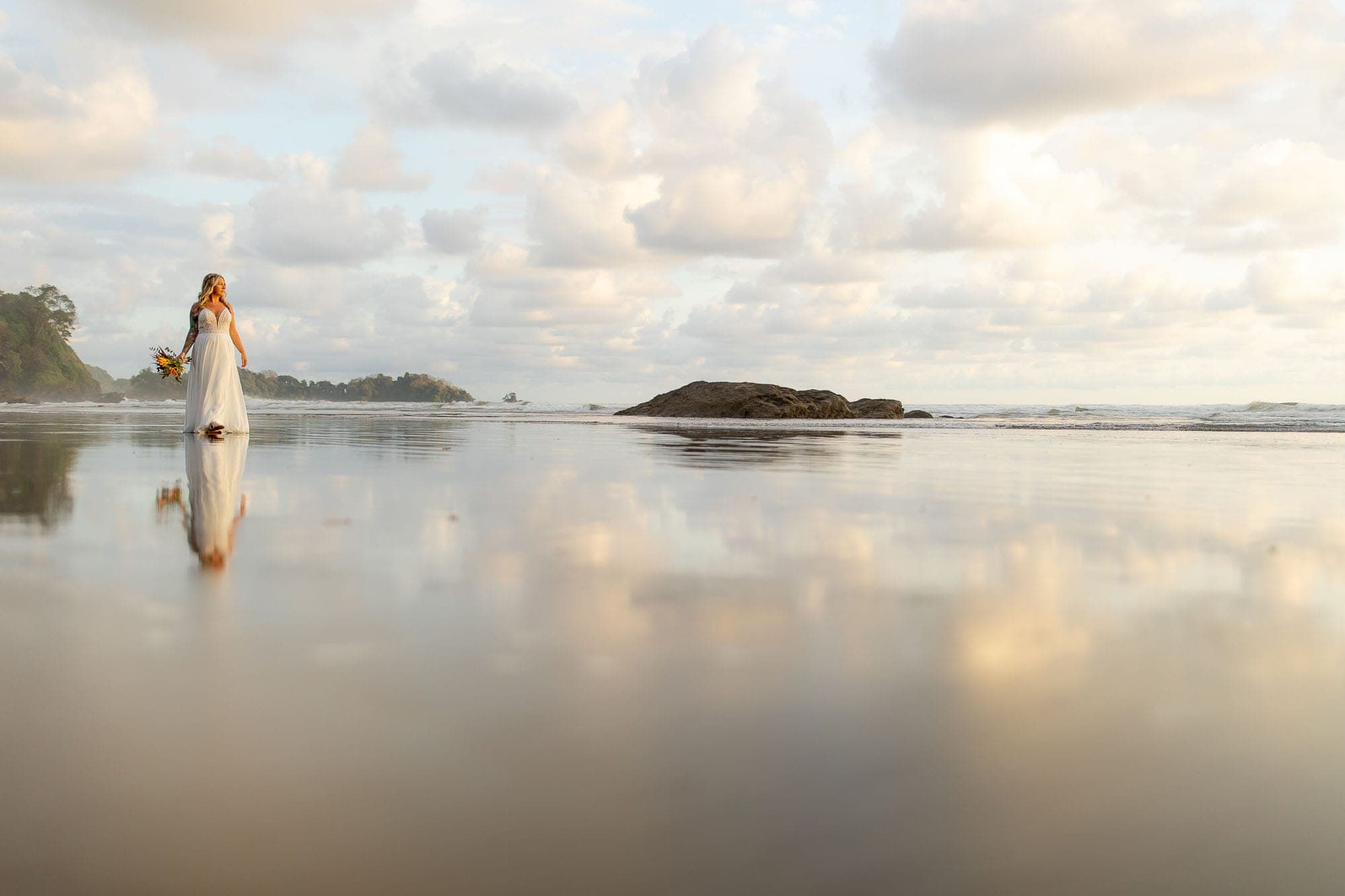 Reflection image of the bride on the beach