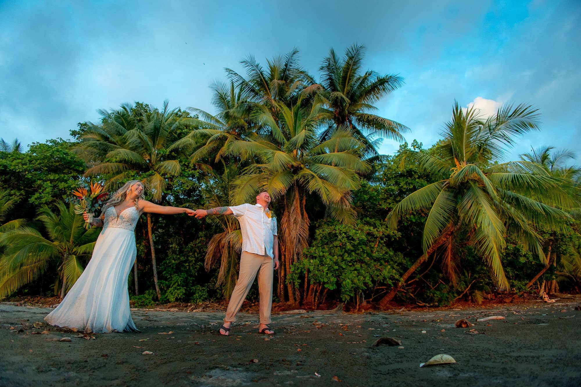 The bride and groom on the beach after their Dominical, Costa rica beach wedding