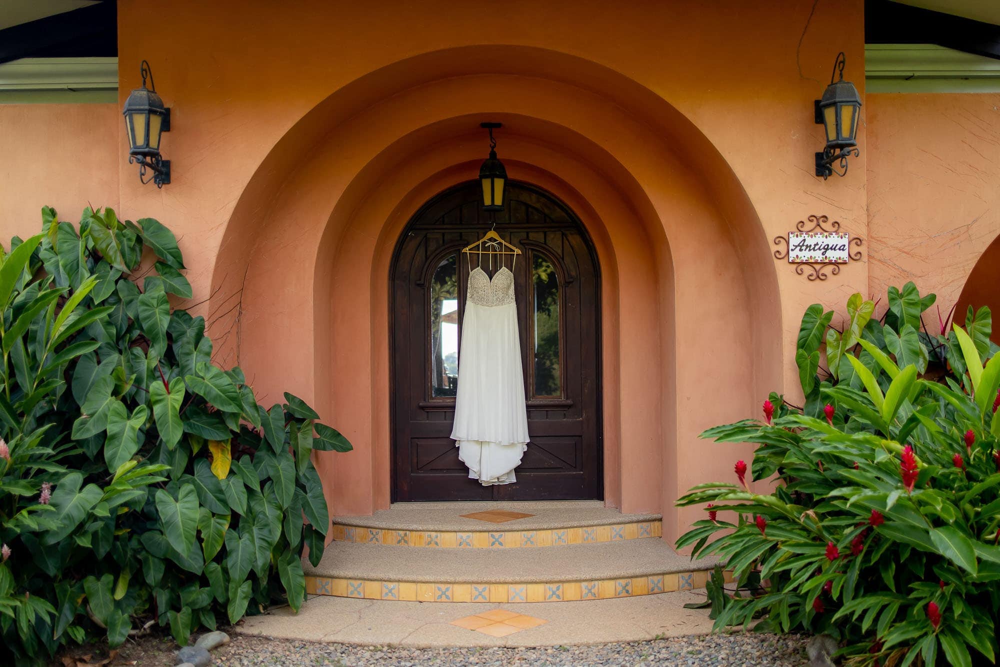 Wedding dress hanging in front of the door to Casa Antigua in Dominical