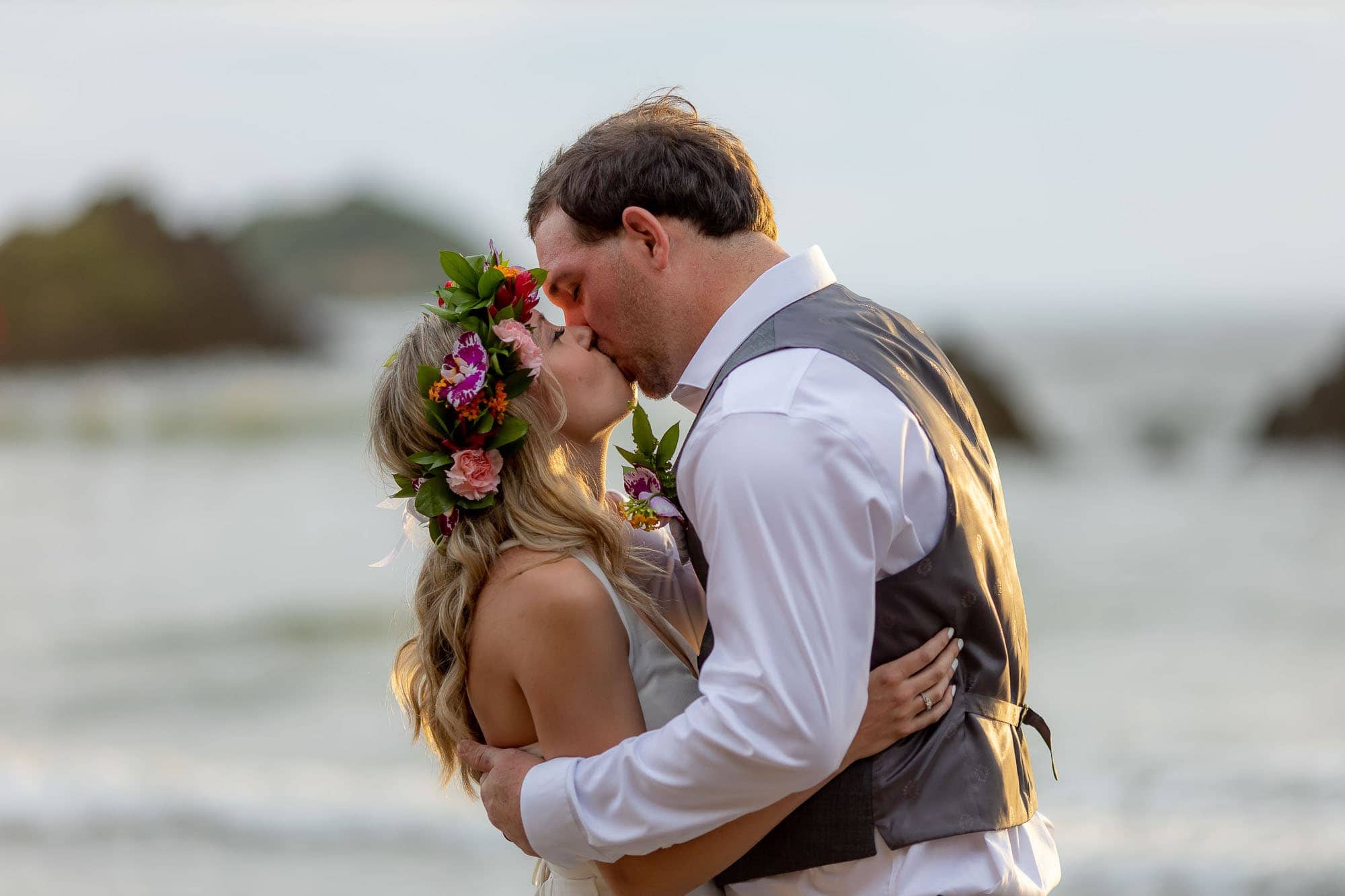 the bride and groom share their first kiss as husband and wife