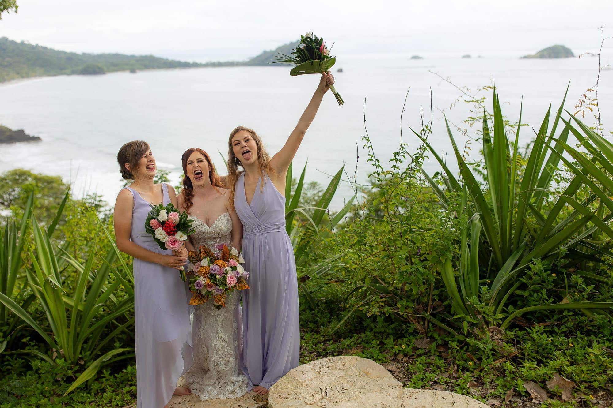 bride and bridesmaids making silly faces