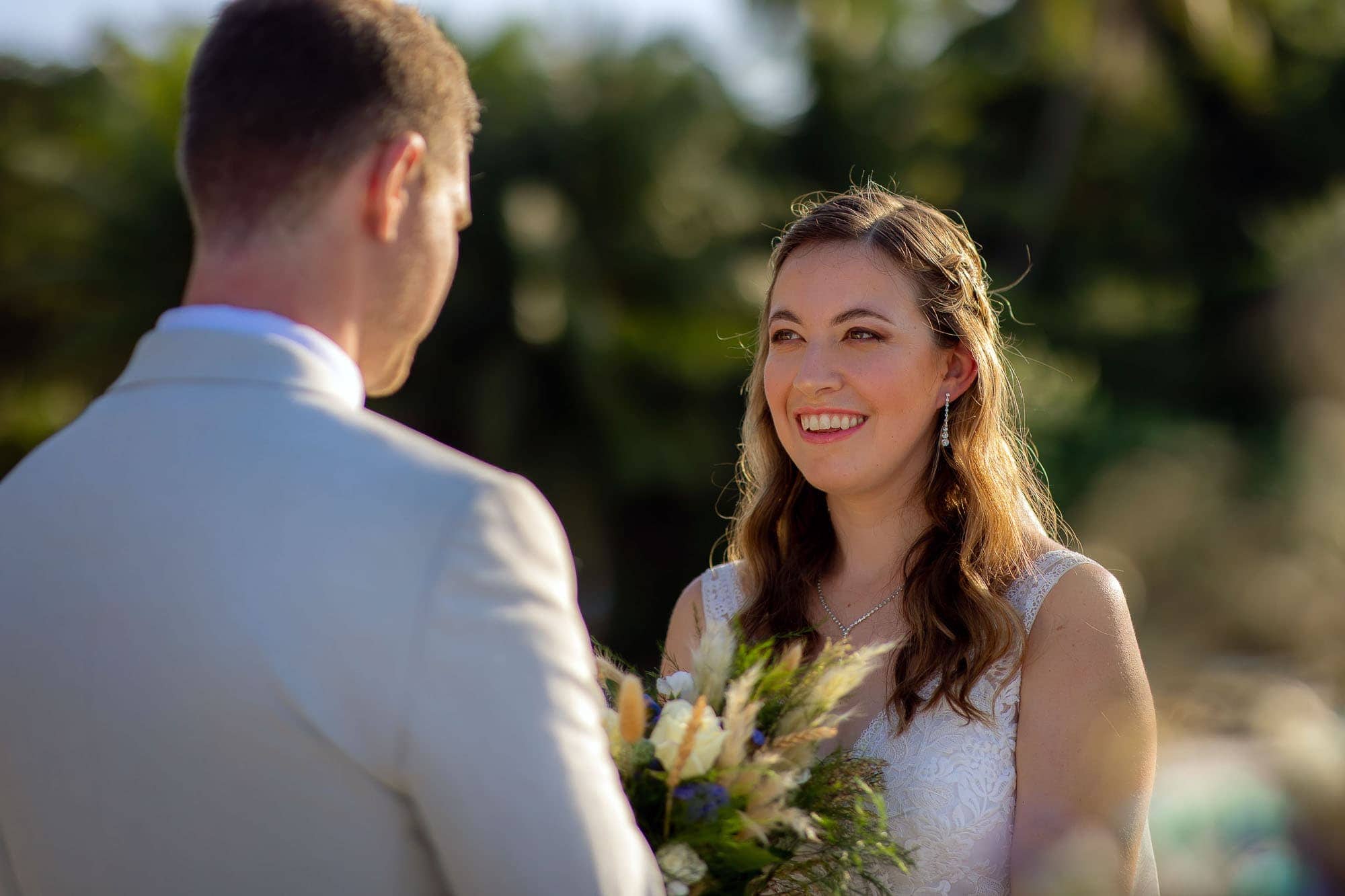the smile on the bride's face during the ceremony