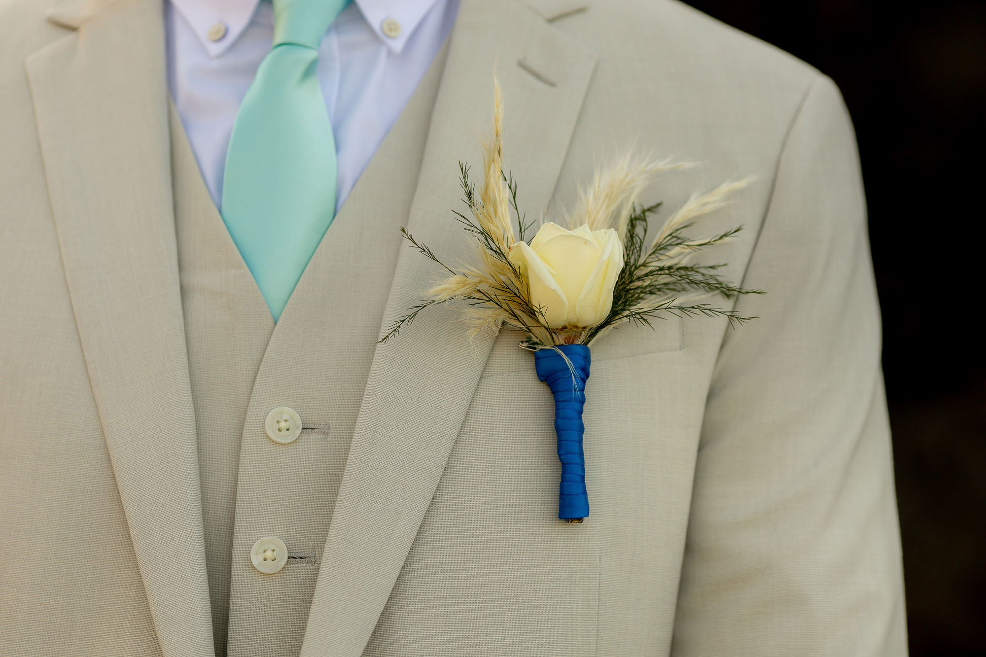 closeup of the groom's boutonniere