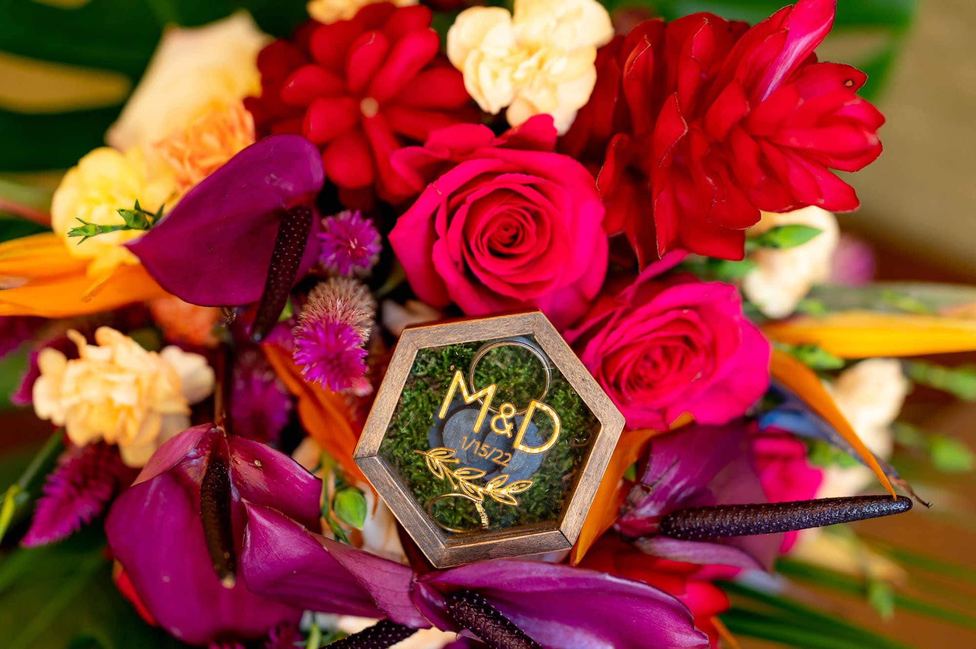 Monogrammed ring box in a bouquet of flowers