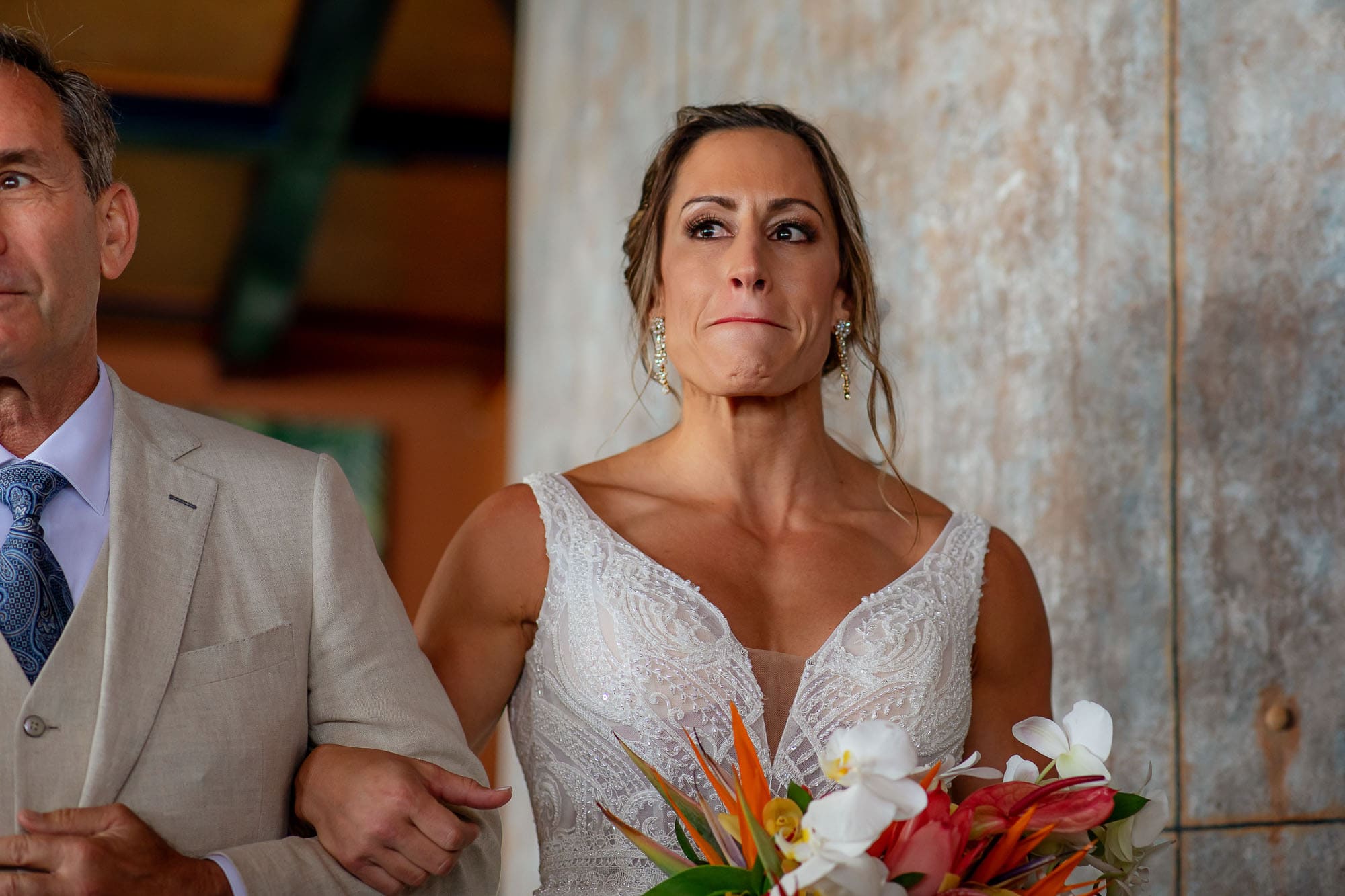 Bride holds back tears as she walks down the aisle