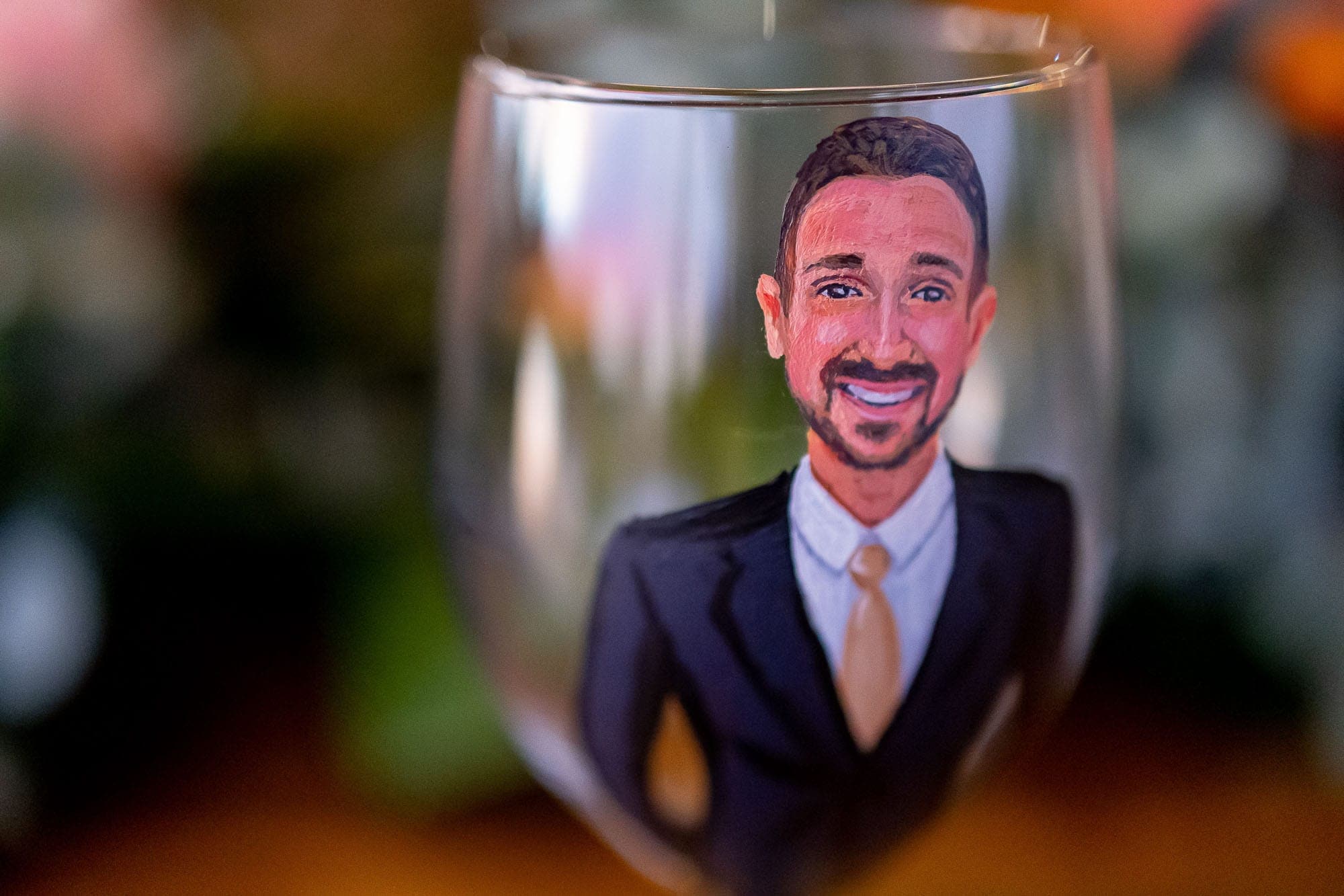 Groom's likeness painted on a glass