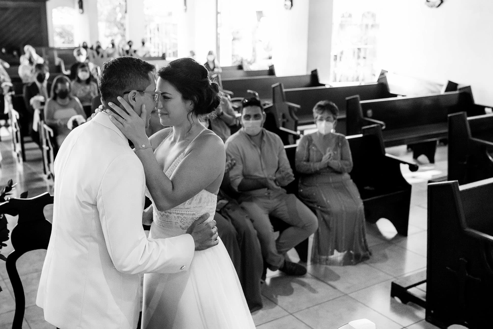 Special kiss the bride moment in black and white