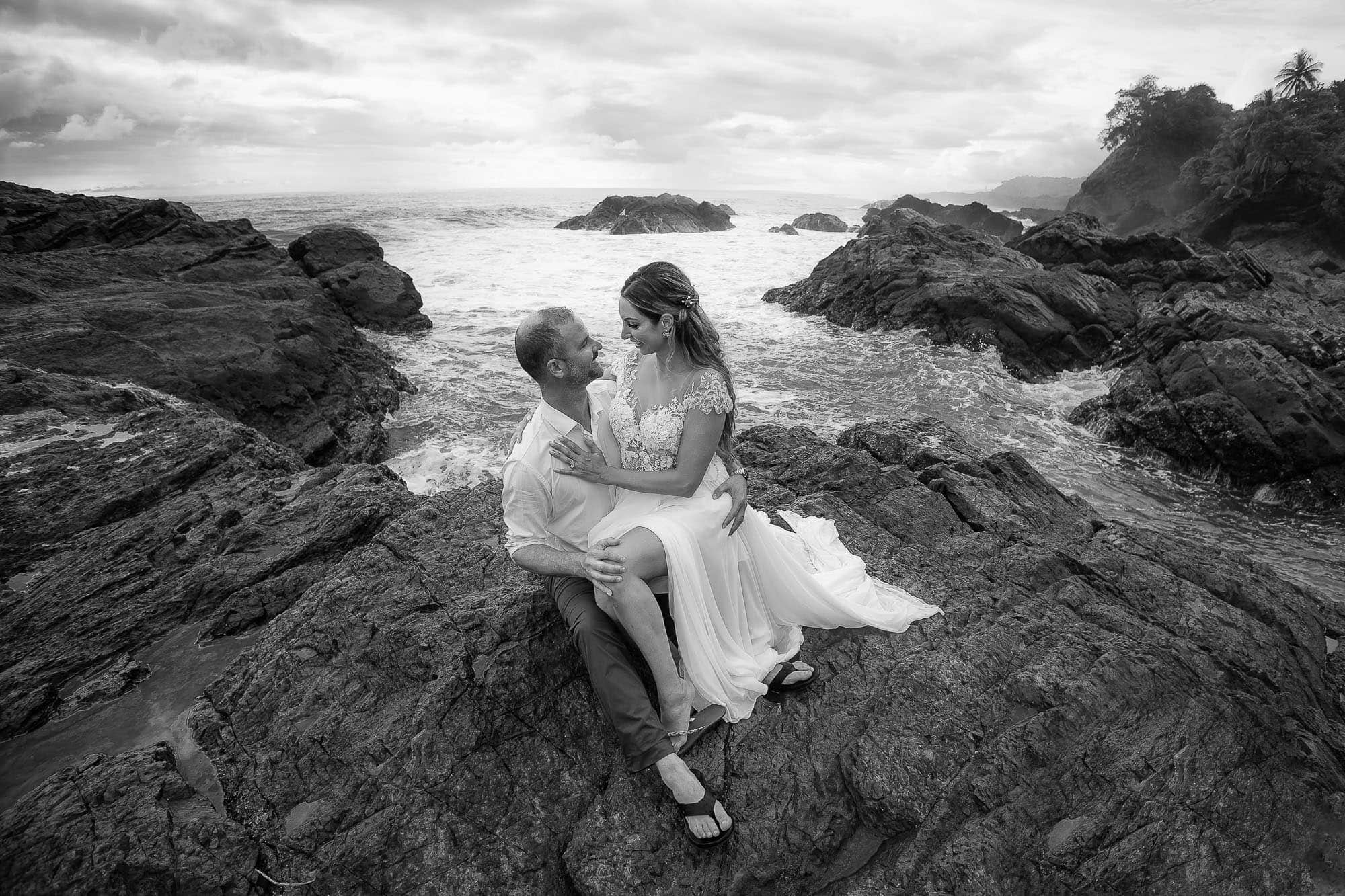 couple on rocks at beach