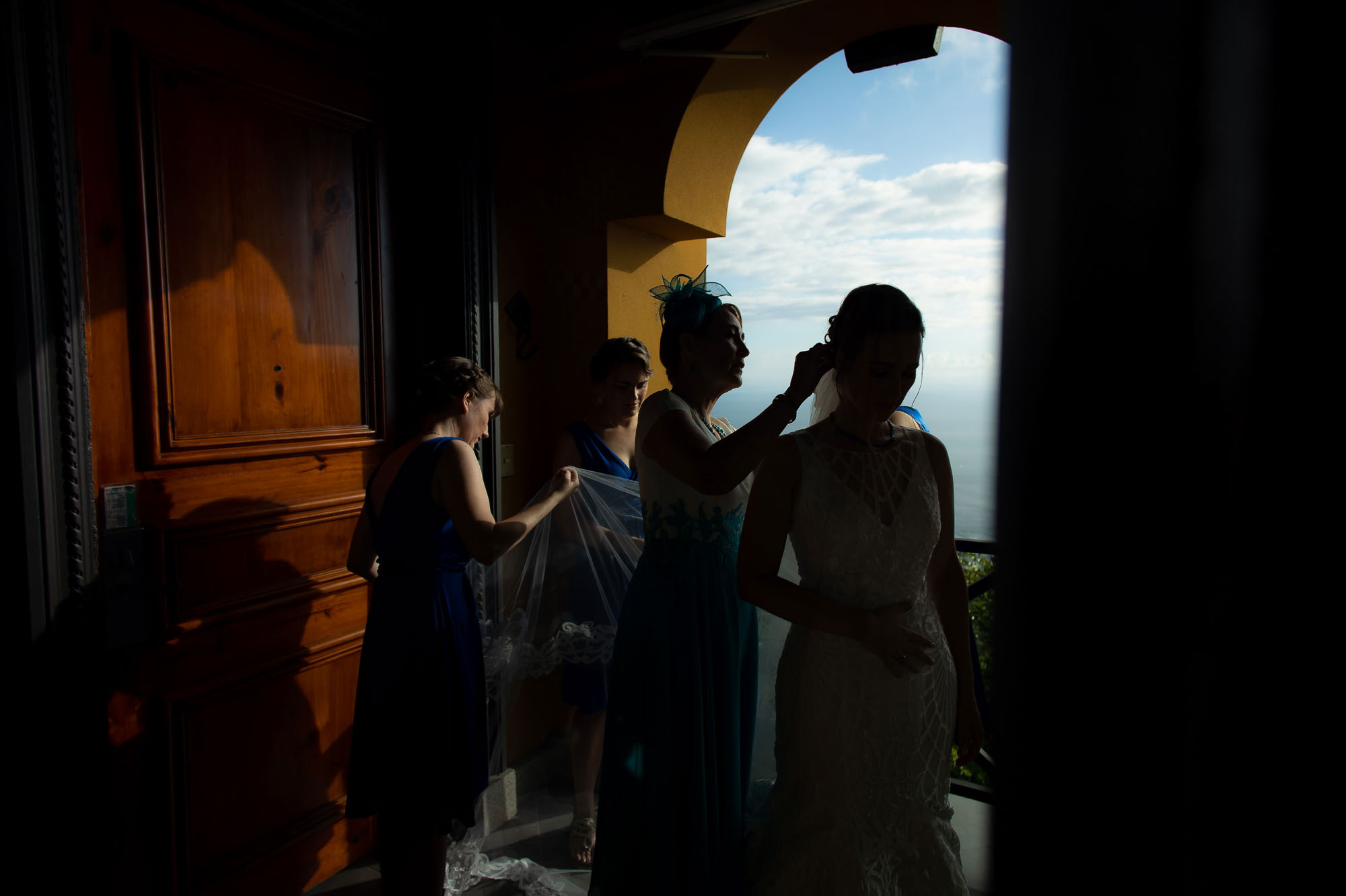 Silhouette of bride and bridesmaids getting ready
