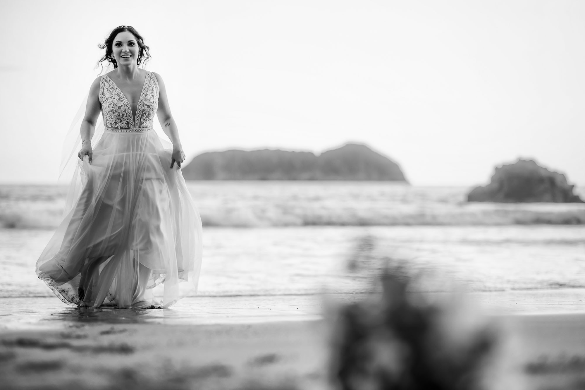 bride running out of water at beach