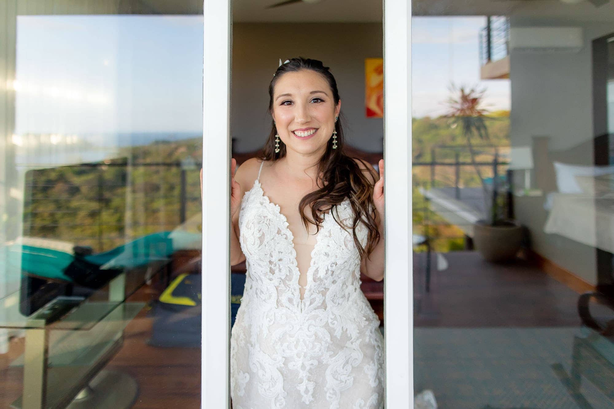 the bride peeking out between two reflective doors