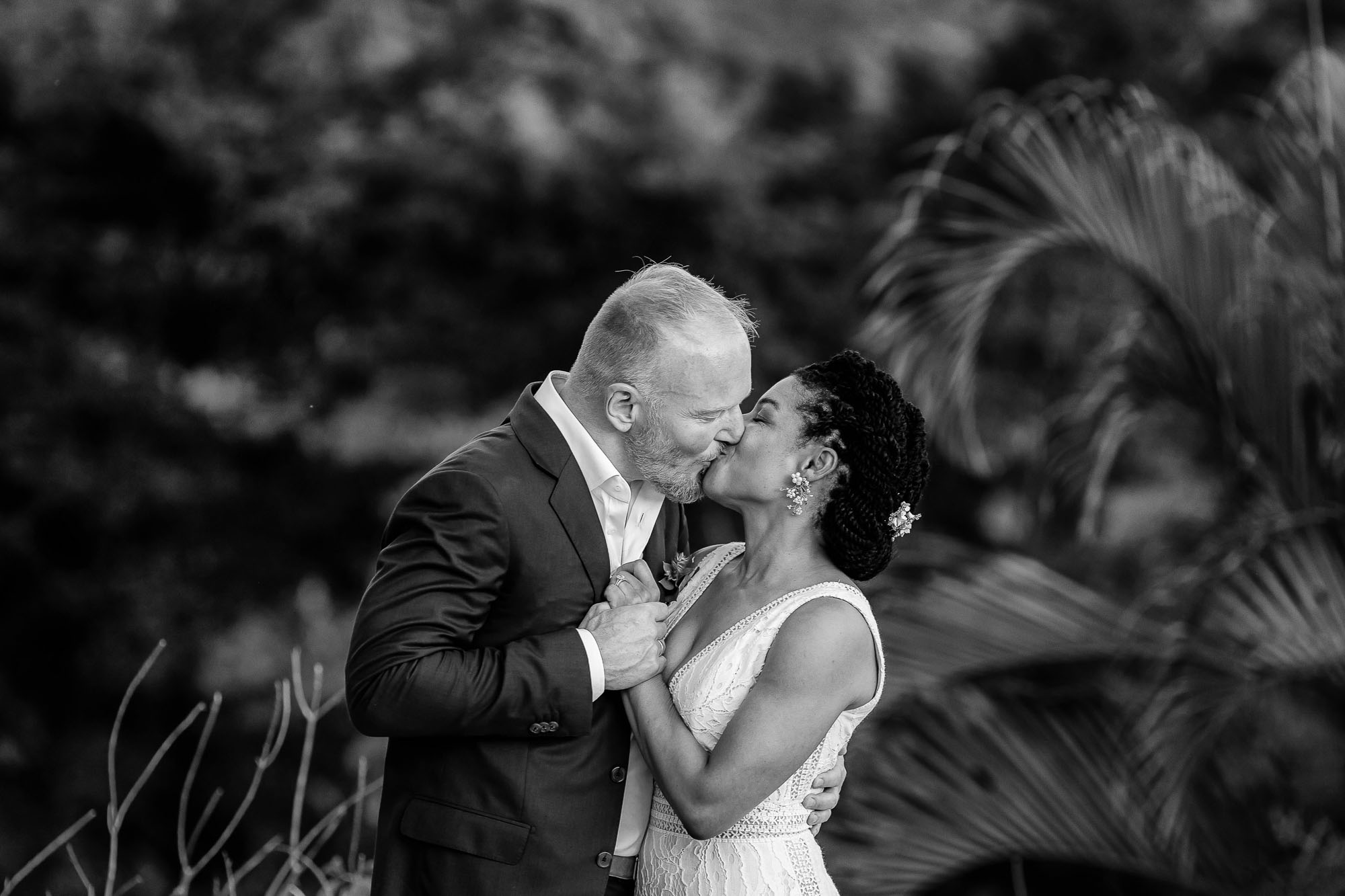 bride and groom share a kiss