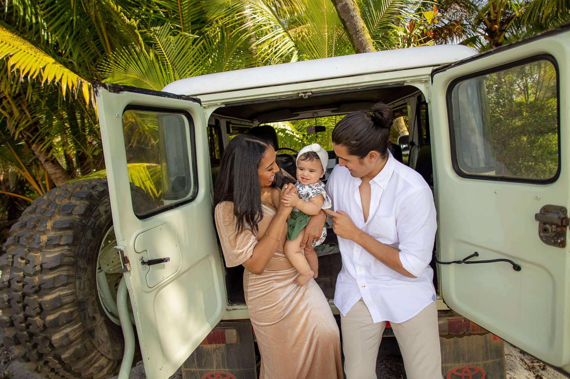 young family in jeep