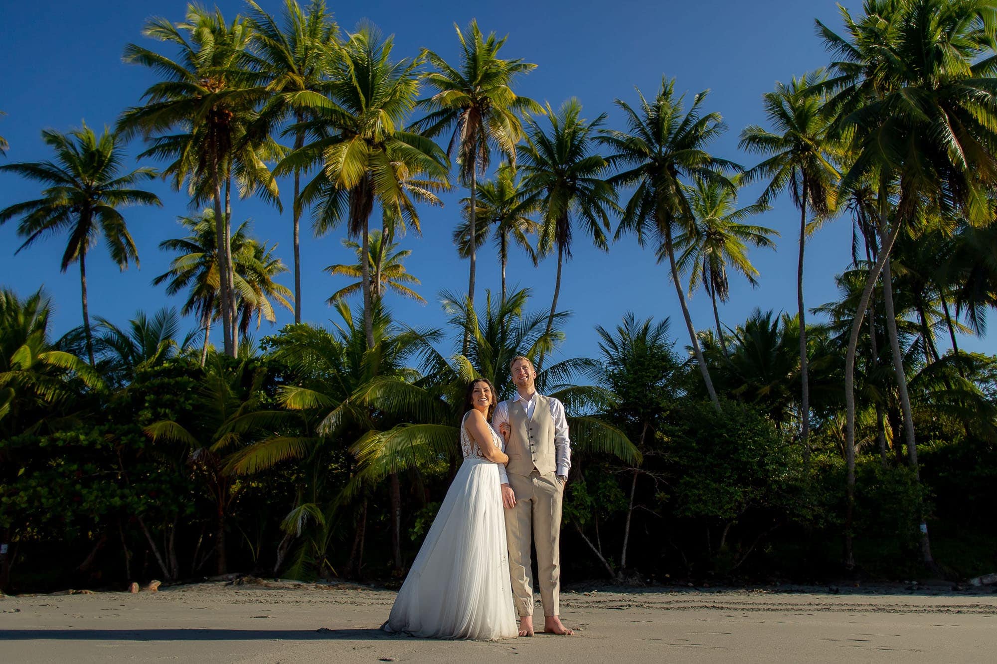 Bride and groom on the beach the morning after their small wedding in Costa Rica