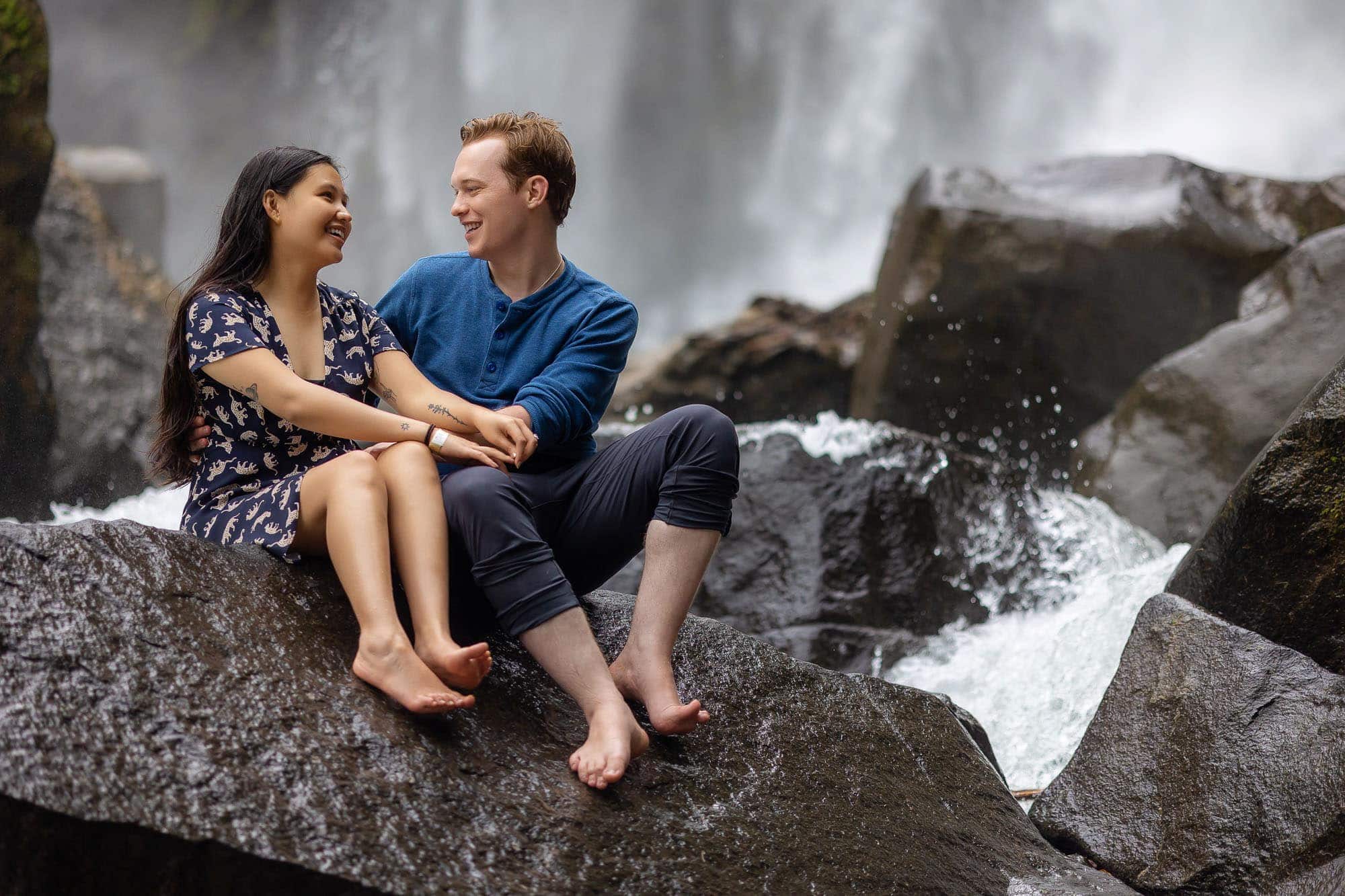 sitting on rocks at Nauyaca waterfalls