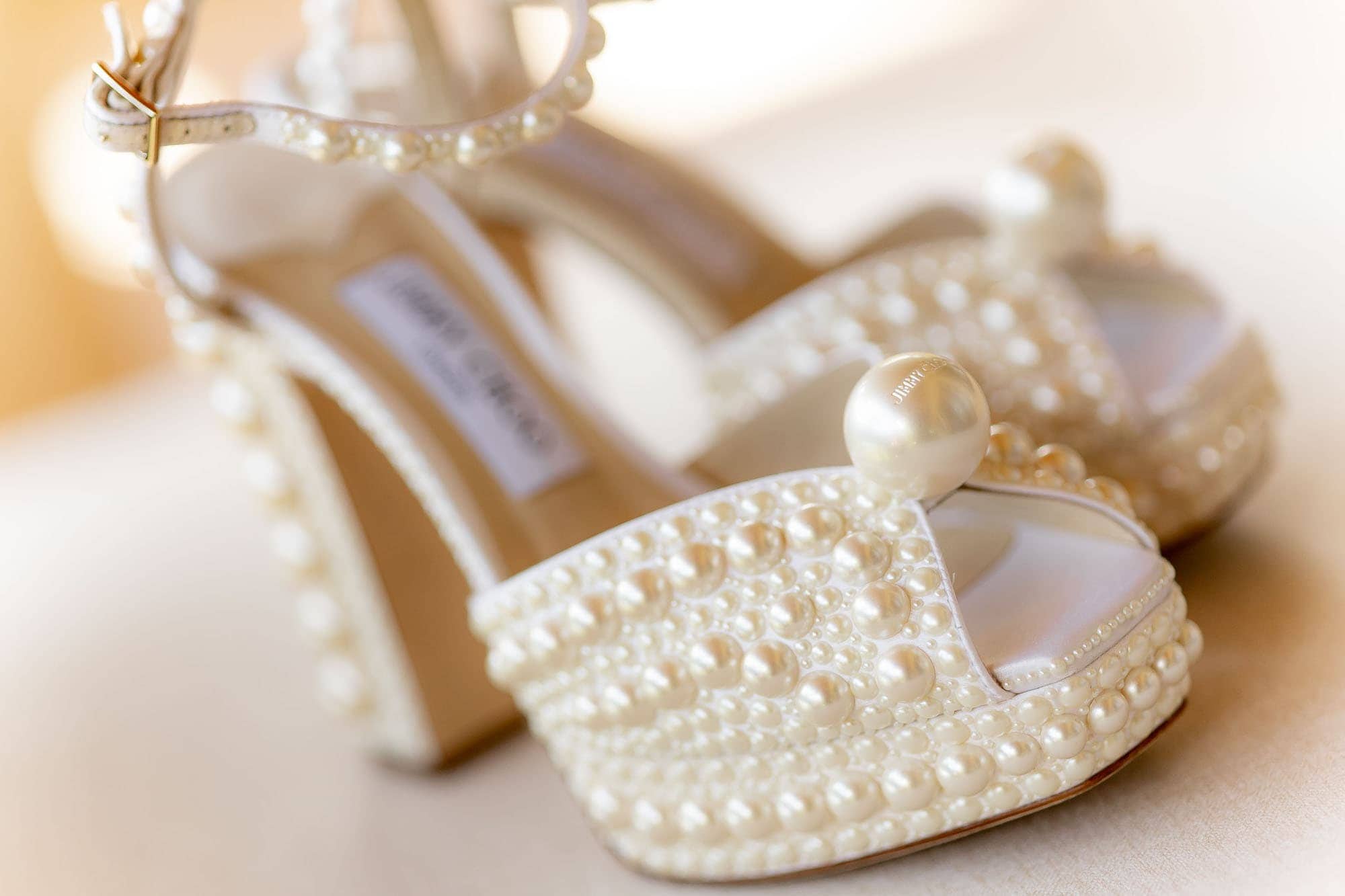 closeup of the bride's white shoes