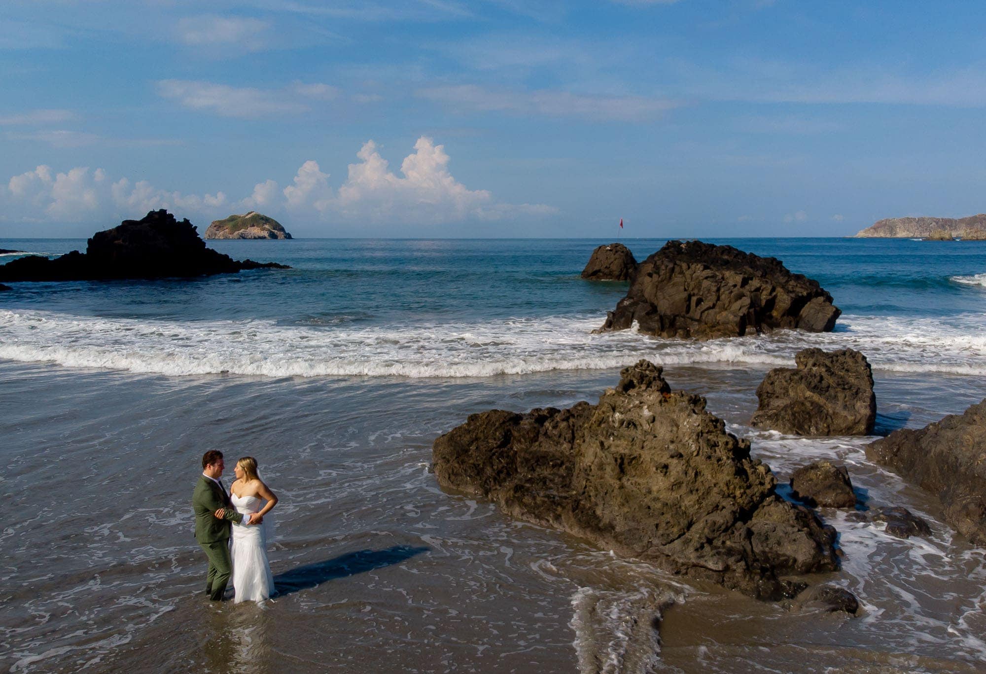 bride and groom creating memories on the beach