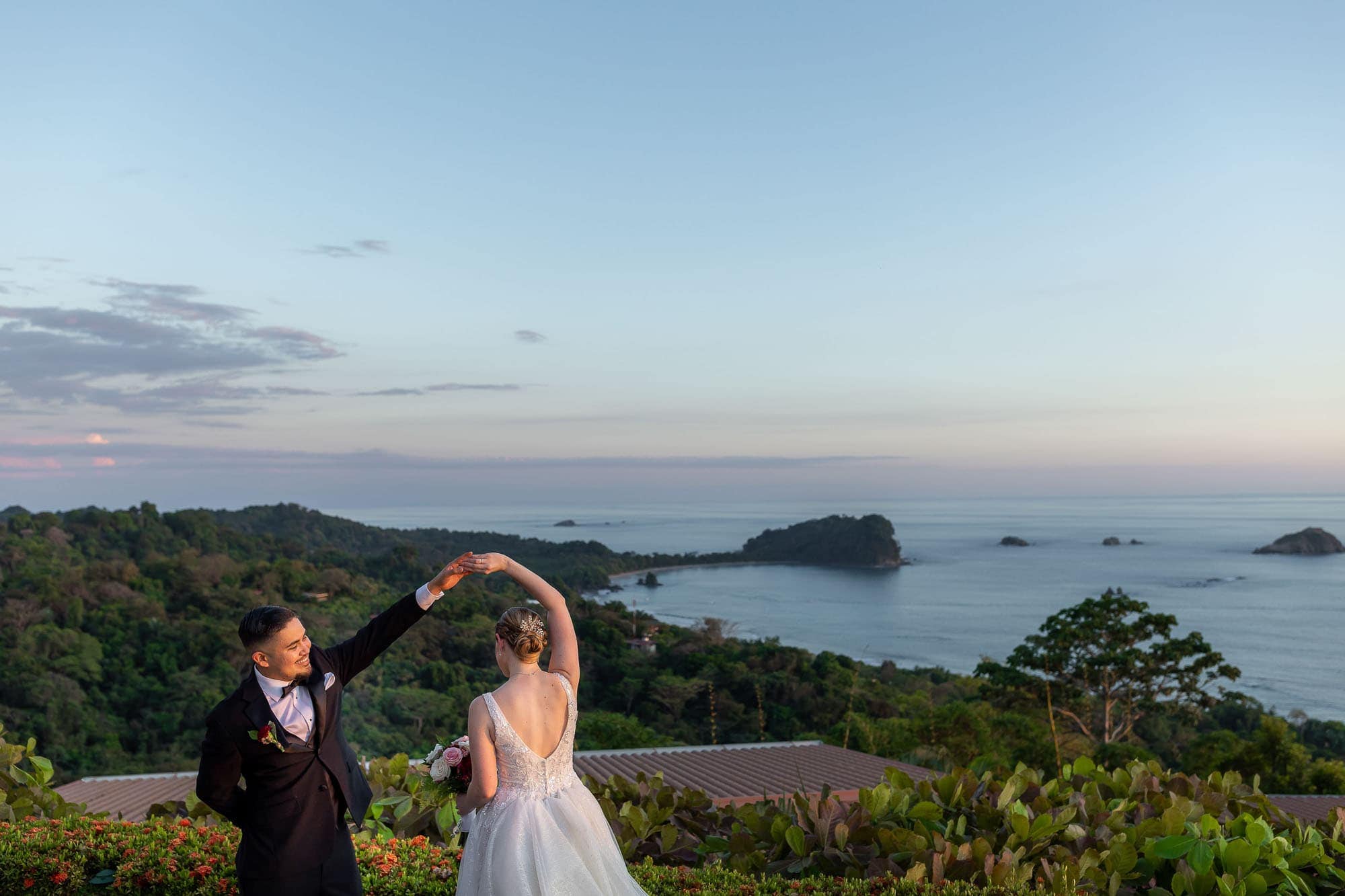 bride and groom dancing in front of the spectacular view