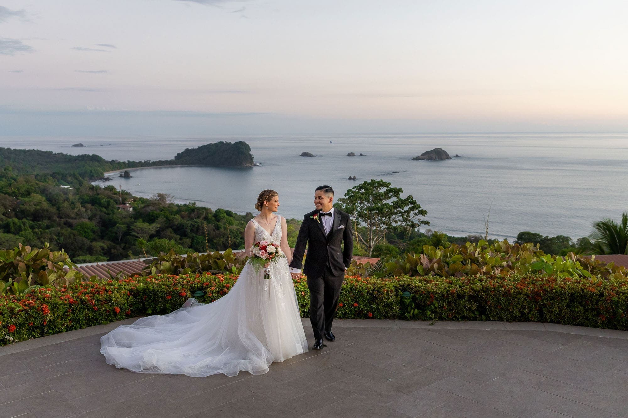 bride and groom posing in front of the spectacular view