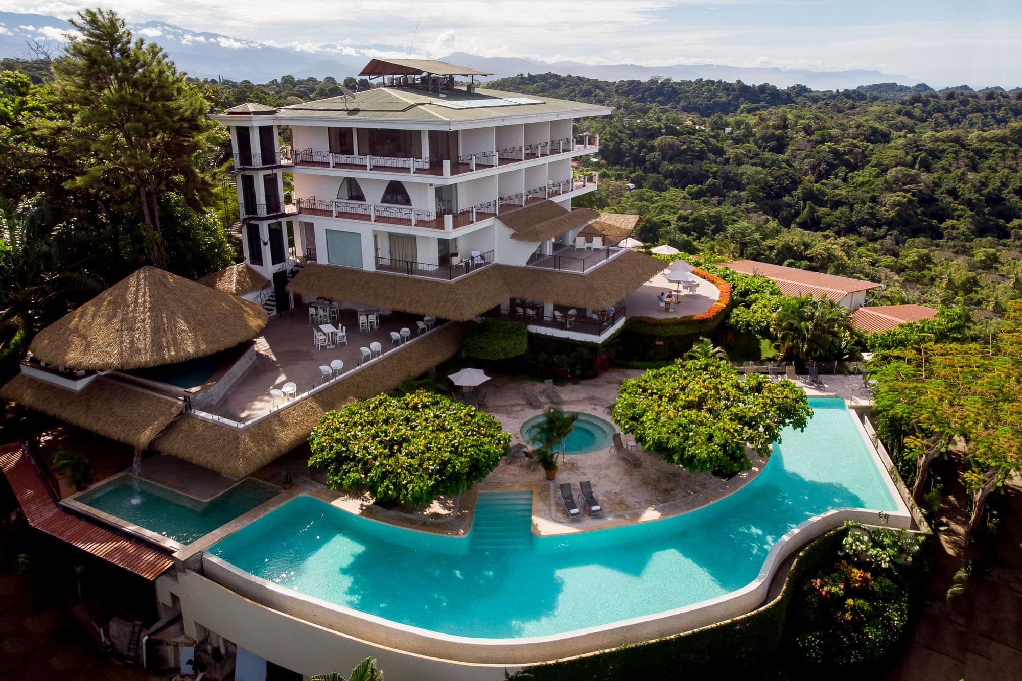 view from the sky of La mariposa hotel with wraparound infinity pool