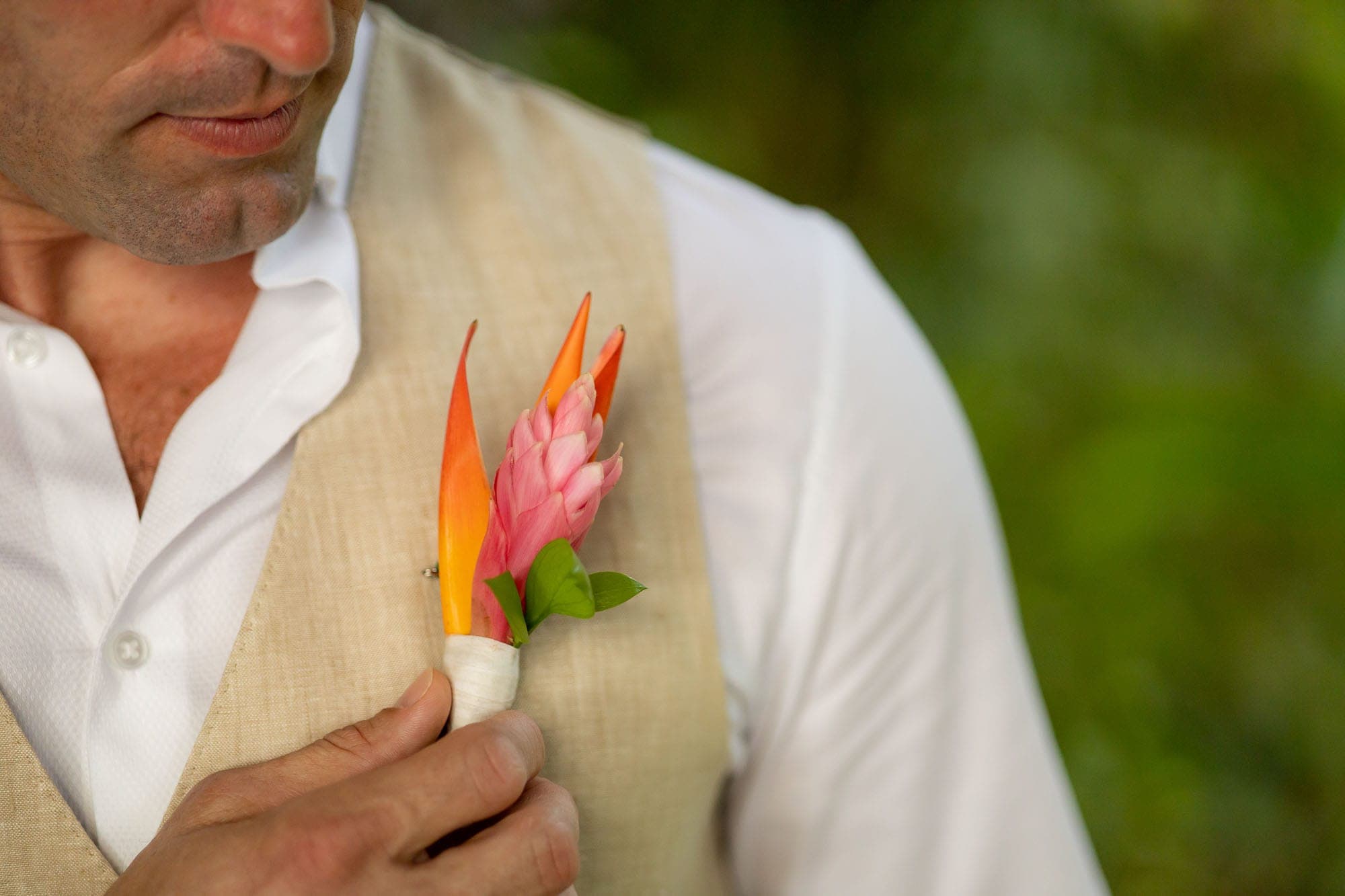 close up of the groom's tropical boutonniere