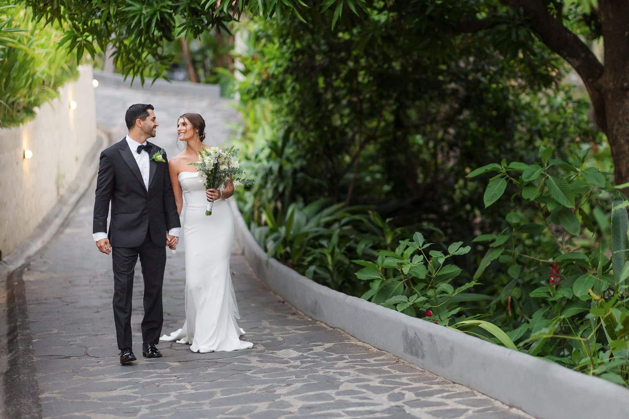 wedding couple walking in parador gardens