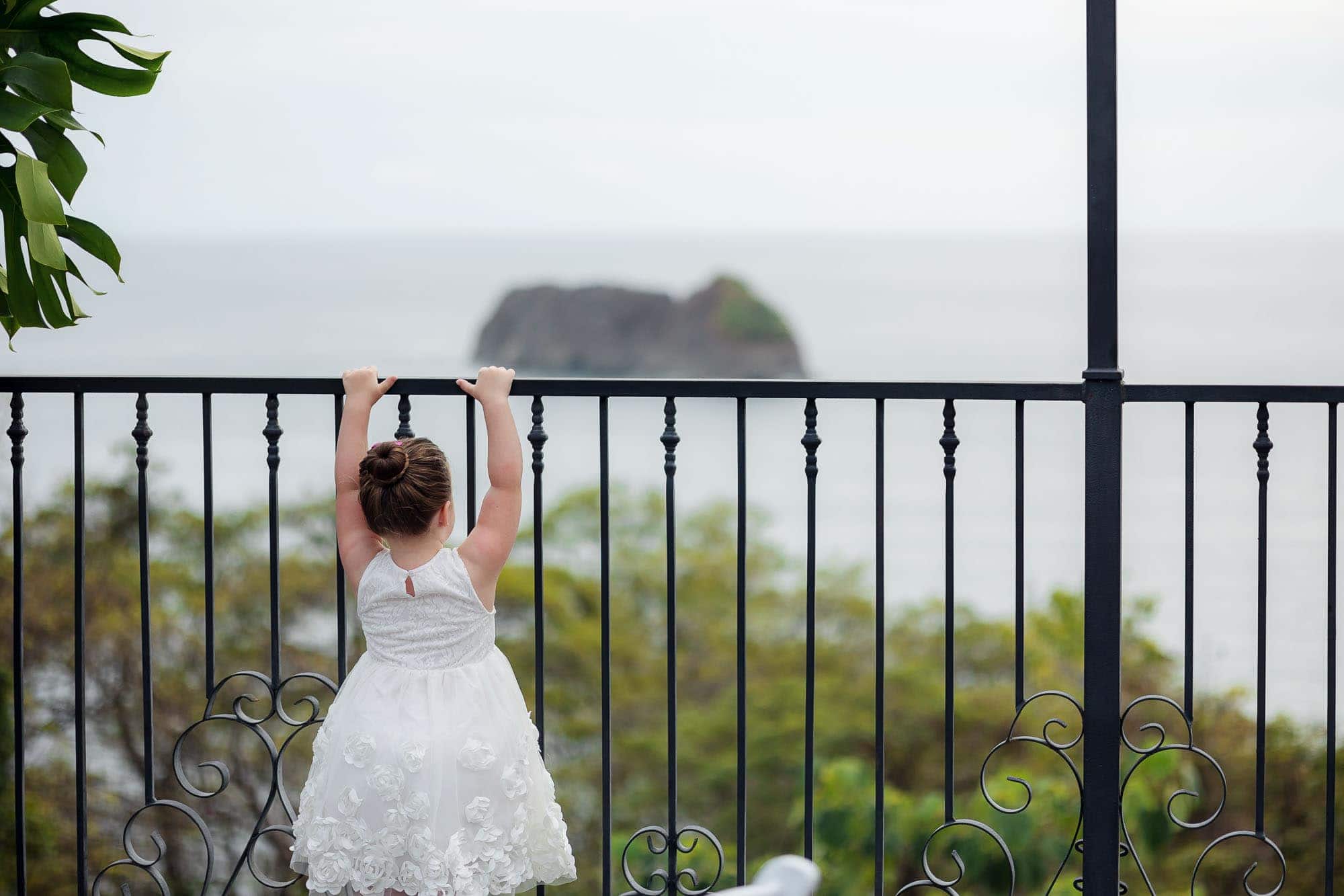 girl looking at ocean at wedding