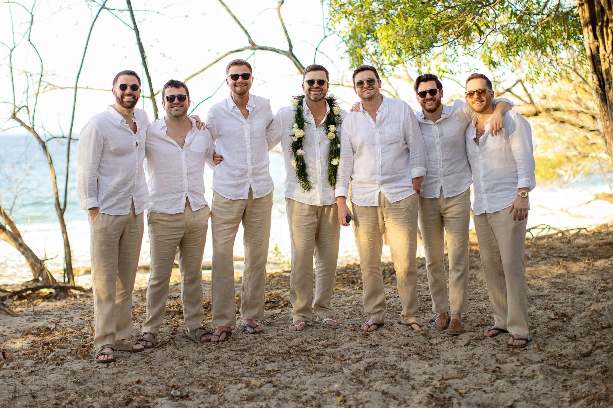groomsman at wedding on beach